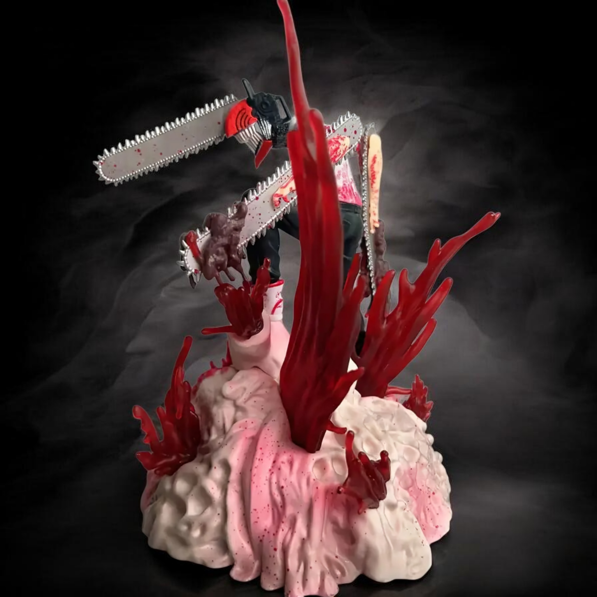 Gory scene with a person being attacked by a chainsaw on a dark background