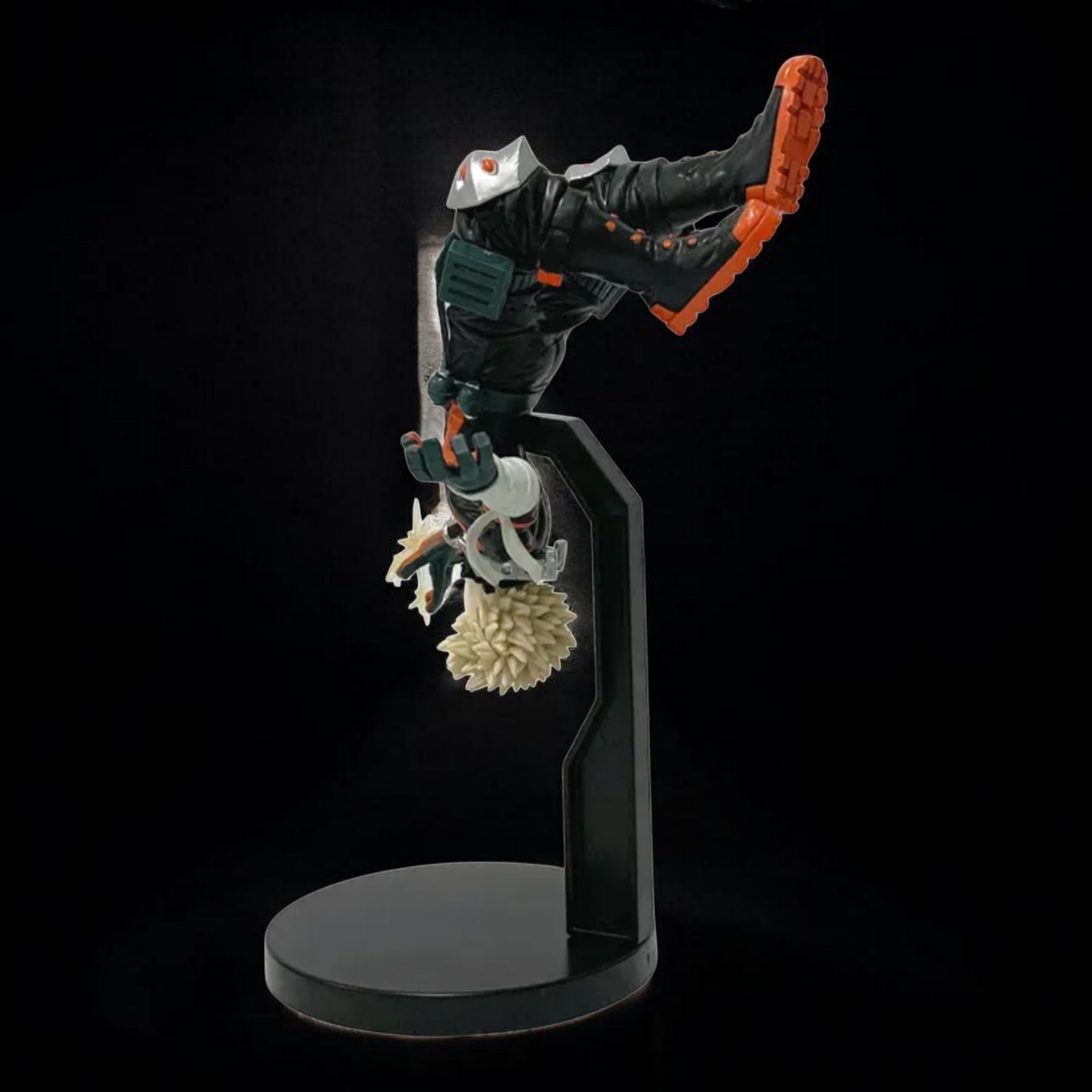 Figurine on a stand with a dark background