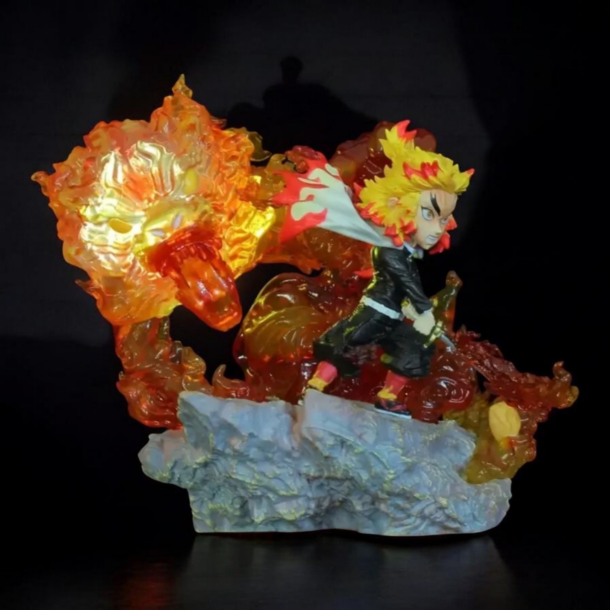 Colorful figurine with a character and fiery elements on a dark background