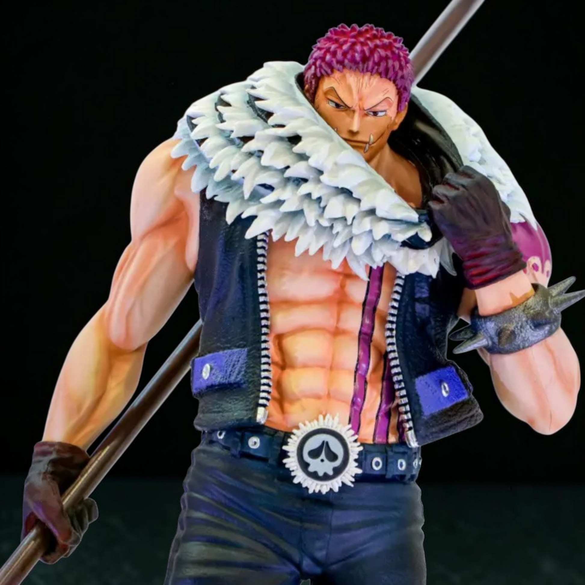 Action figure of a character with purple hair and a white cape holding a sword on a black background
