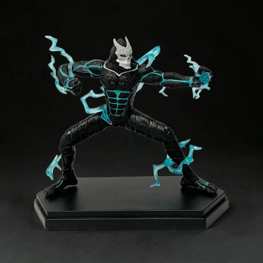 Statue of a superhero in a dynamic pose with lightning effects against a destroyed cityscape.
