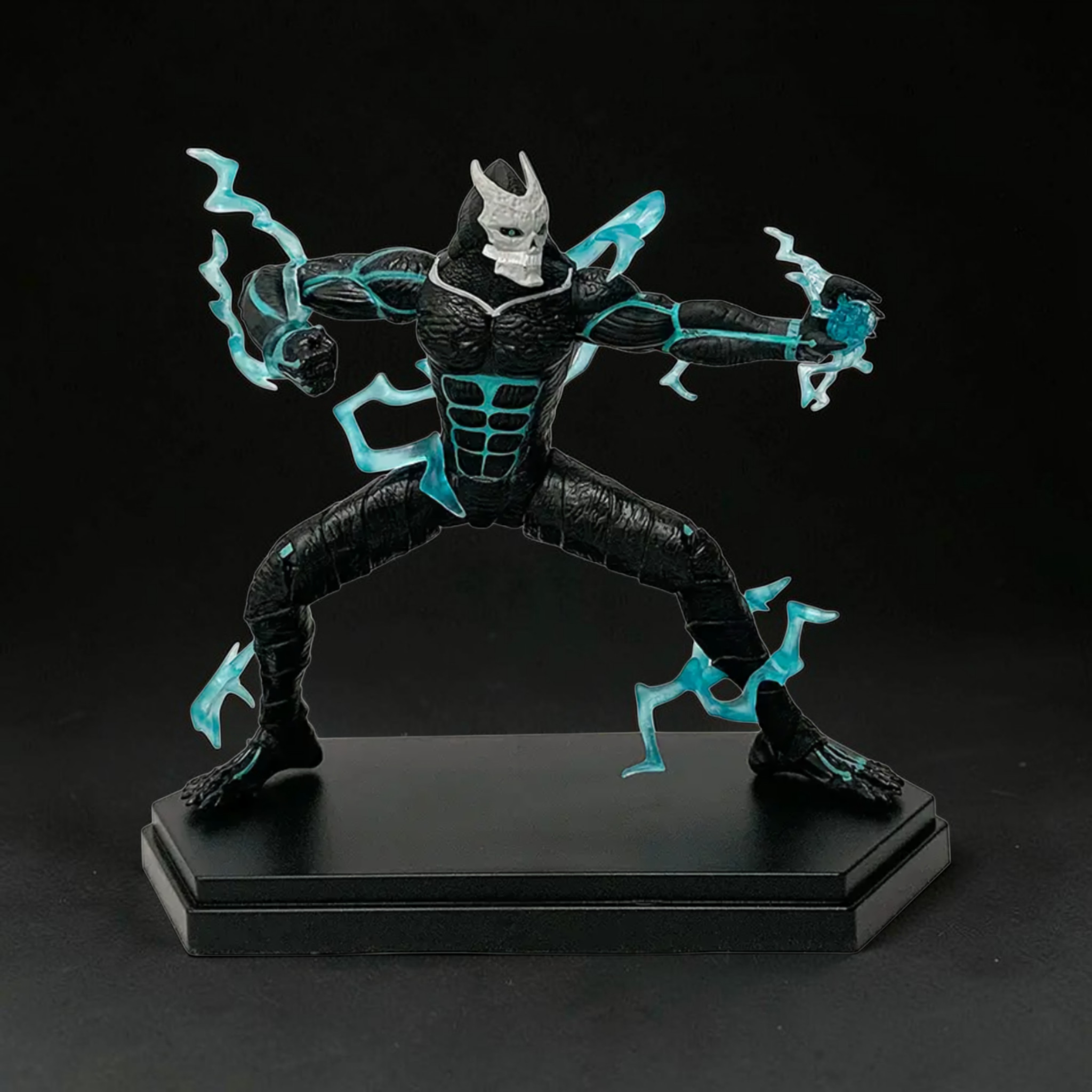Black and blue superhero figurine on a black background
