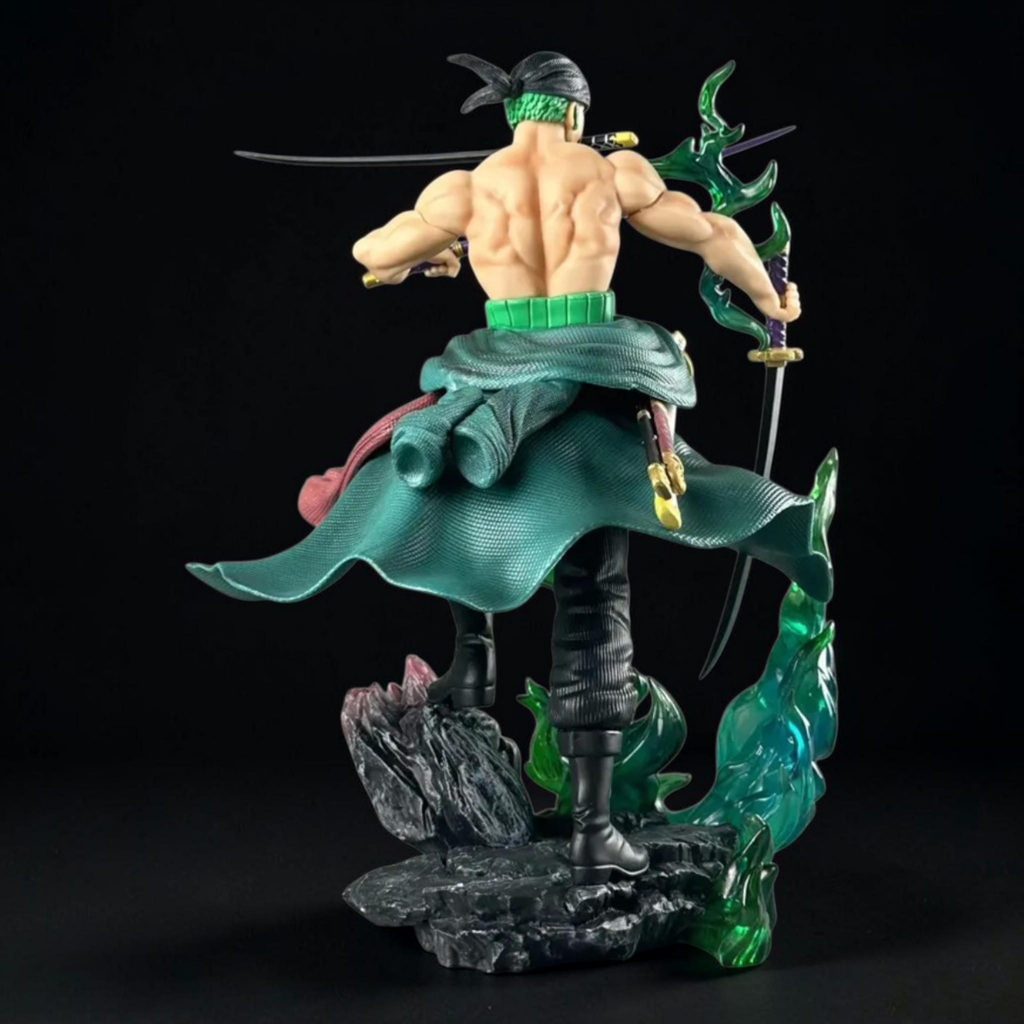 Animated character figure with green outfit and sword on a black background