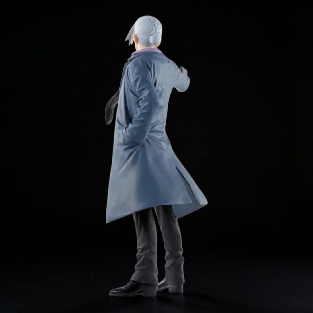 Action figure in a dramatic pose in a store with smoke and debris