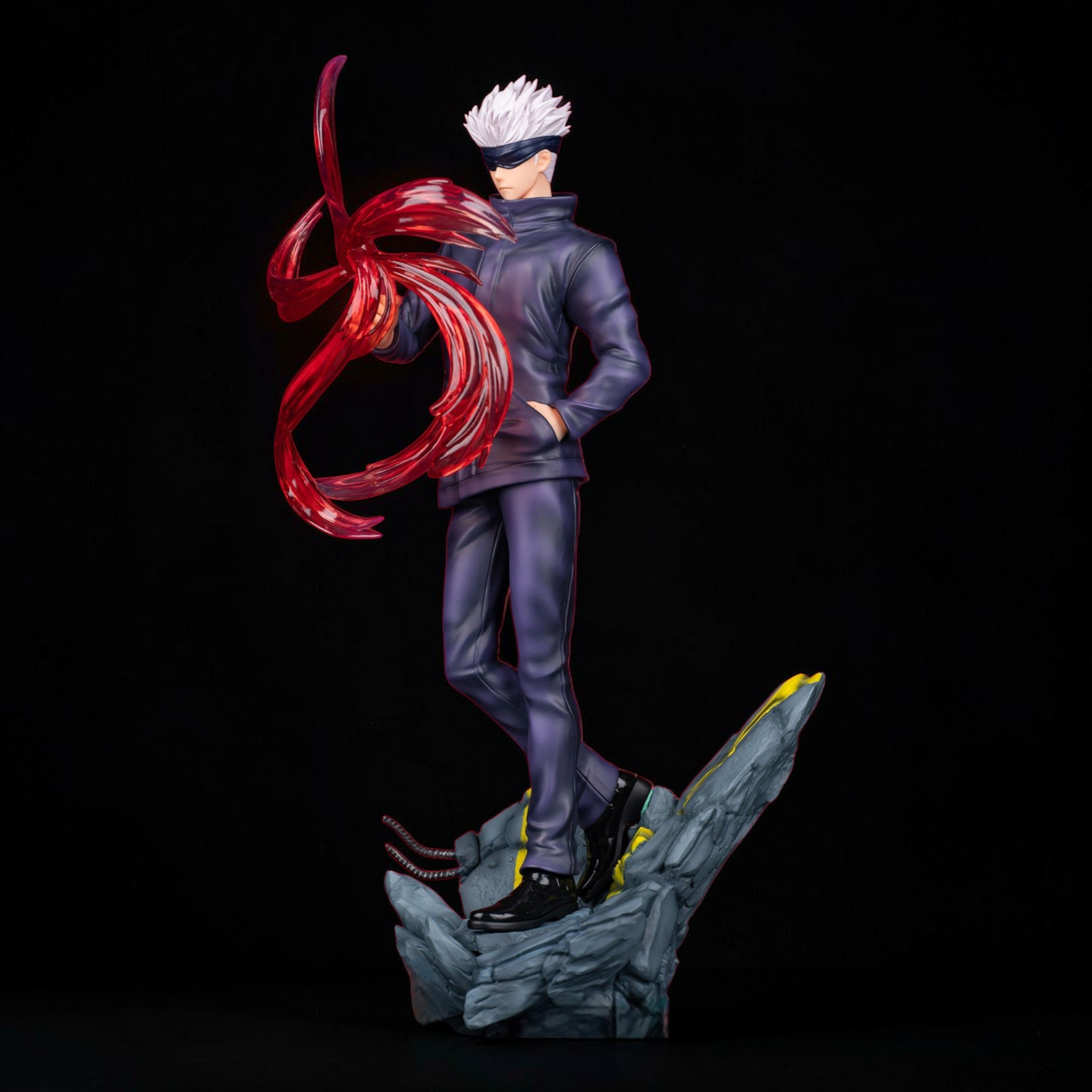 Statue of a character with red hair and a black outfit on a dark background