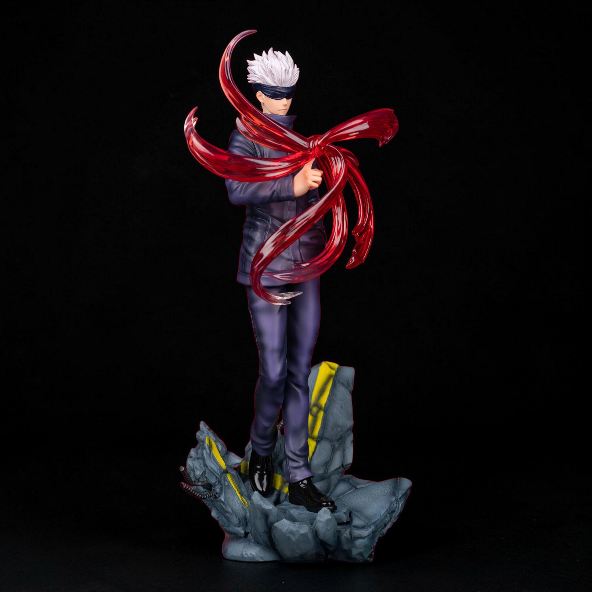 Statue of a character with red hair and cloak on a dark background