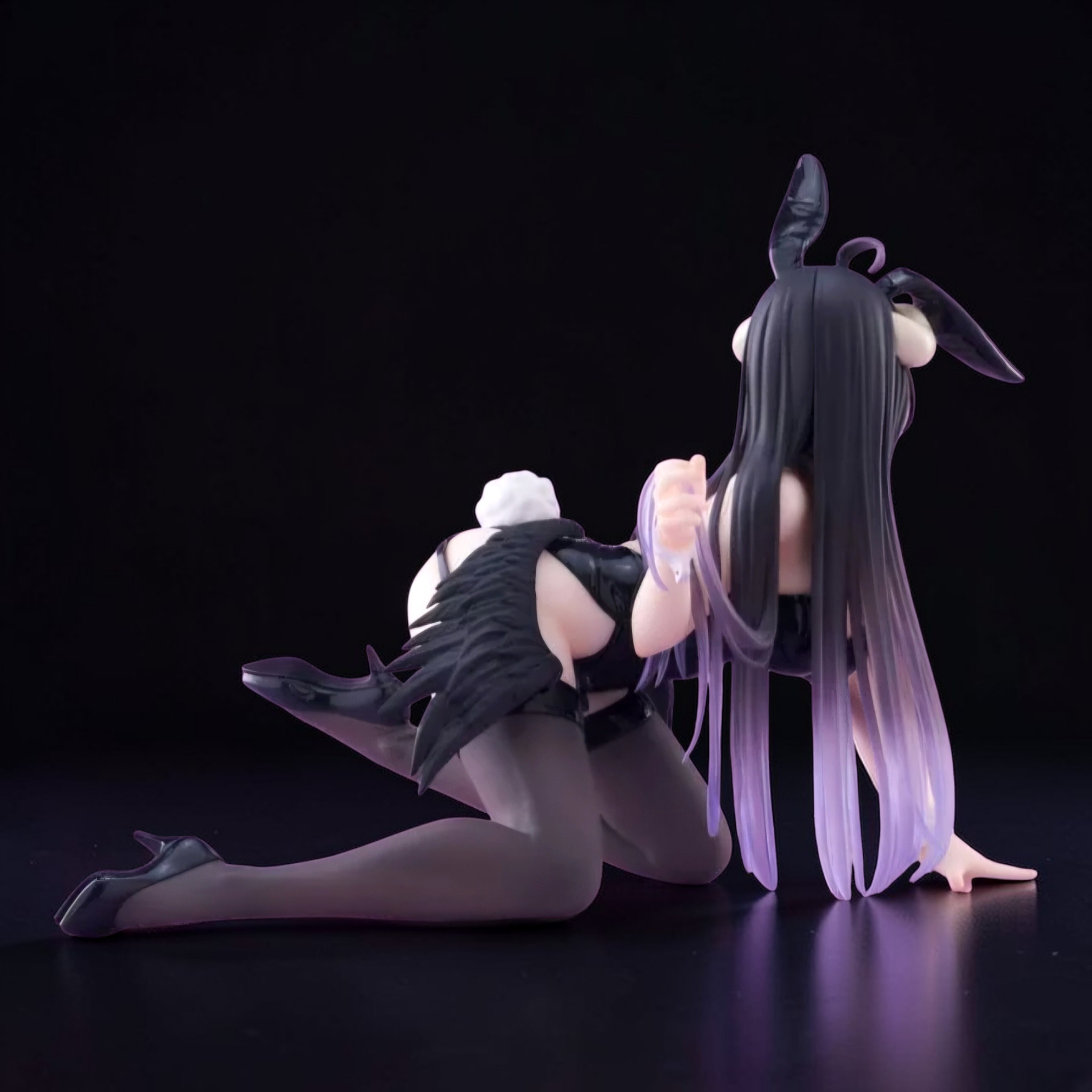 Two anime-style figures with long hair and black outfits on a black background