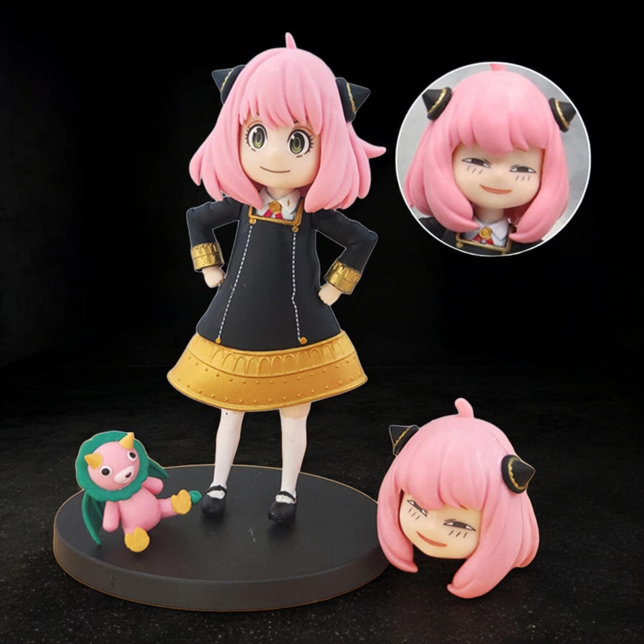 Anime character figurine with pink hair and black outfit on a black background 