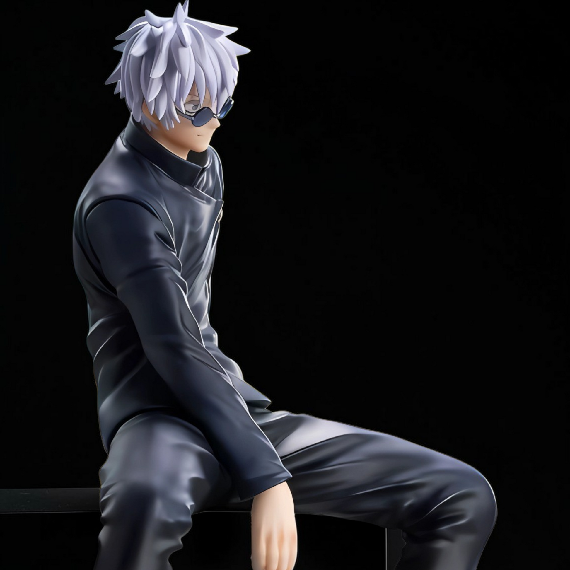 Anime character figurine with white hair and dark outfit sitting on a black background