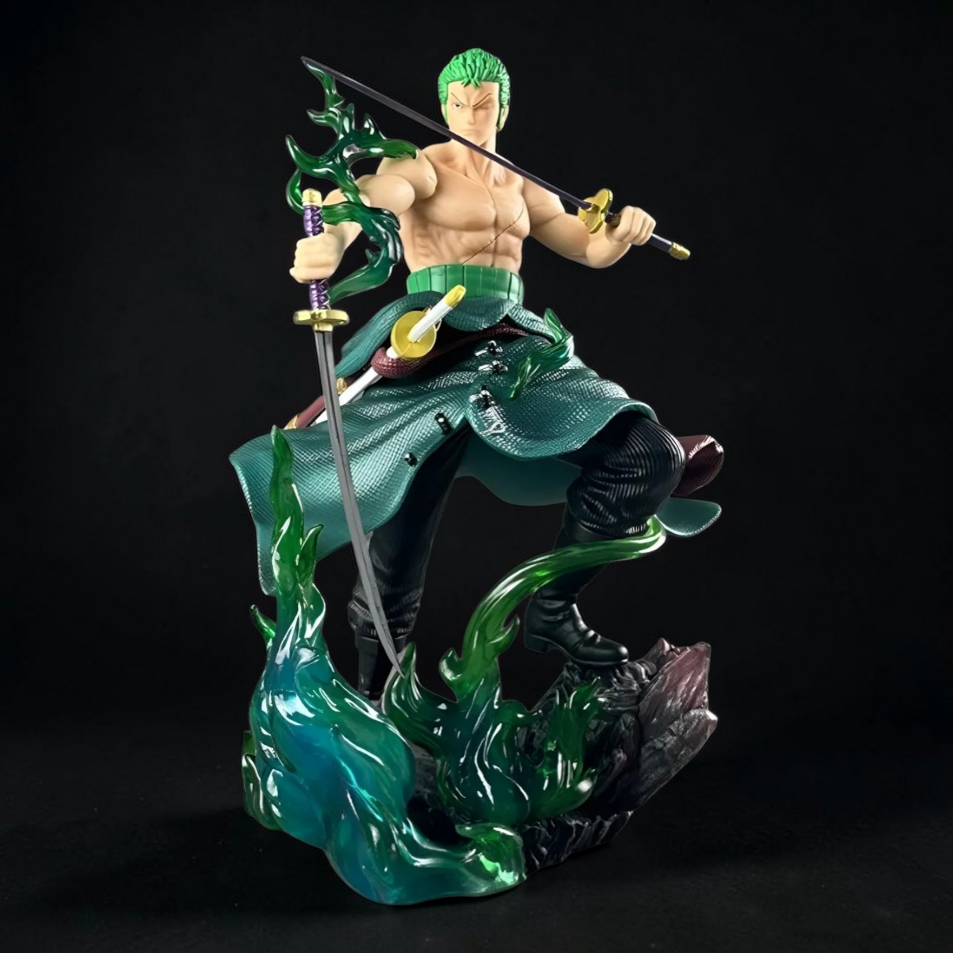 Figurine of a character with green hair and green outfit, holding weapons on a black background