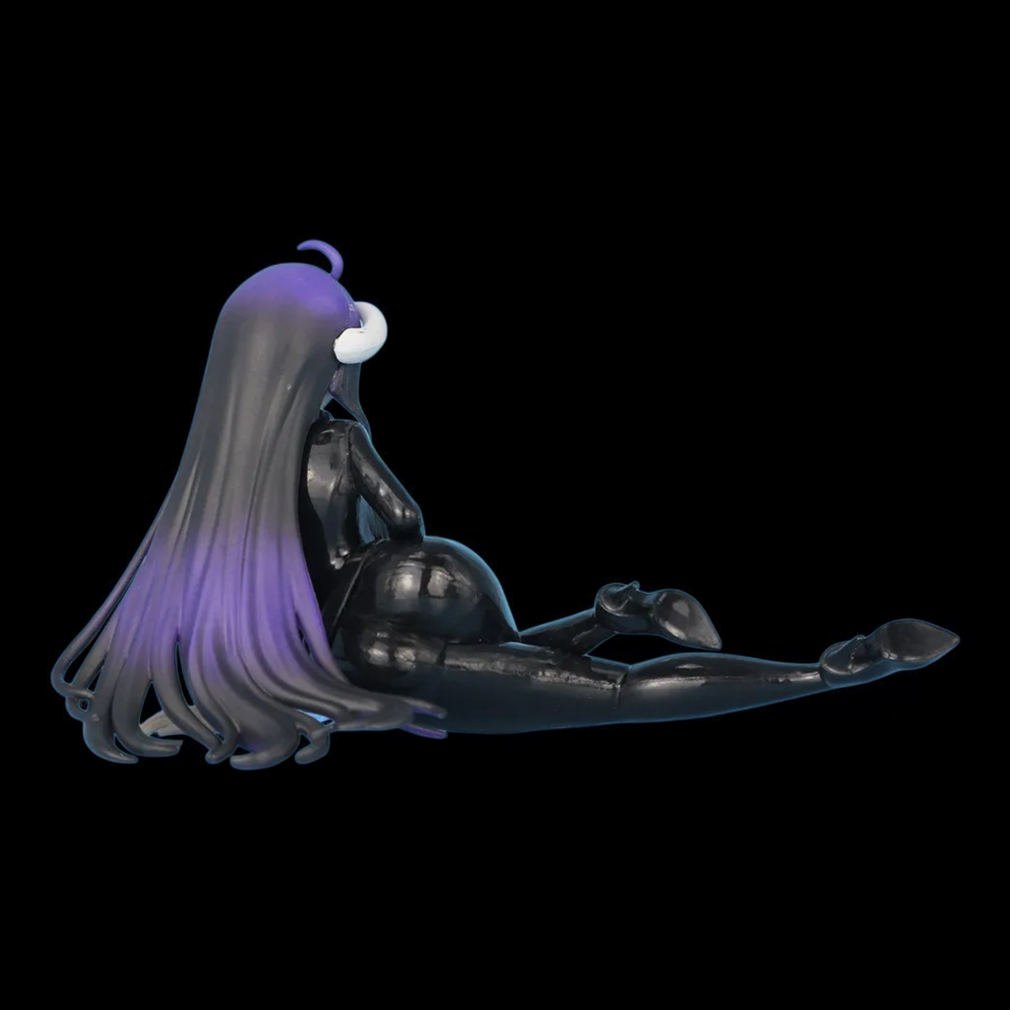 Black and purple character figurine on a black background