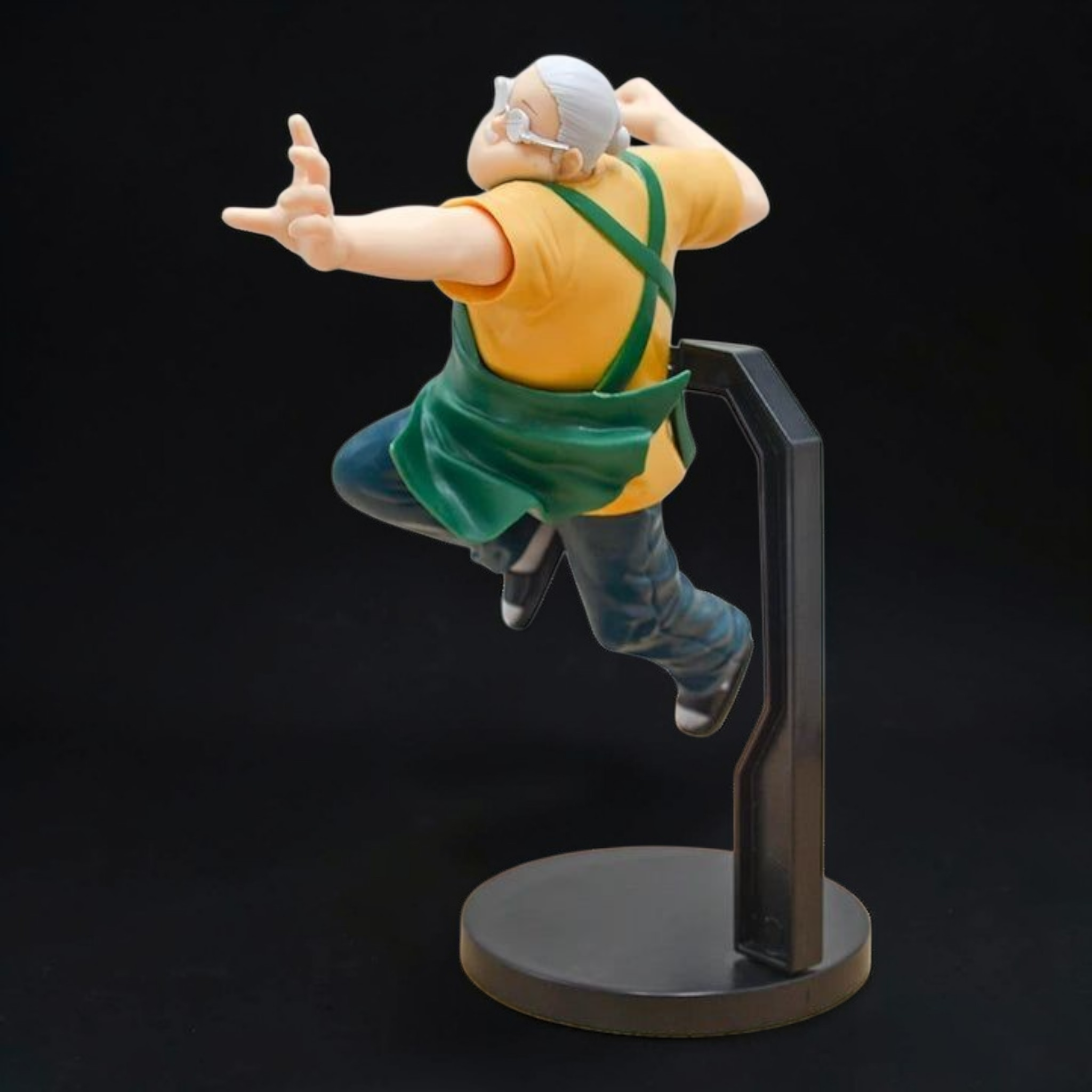 Action figure of a character in a dynamic pose on a black background