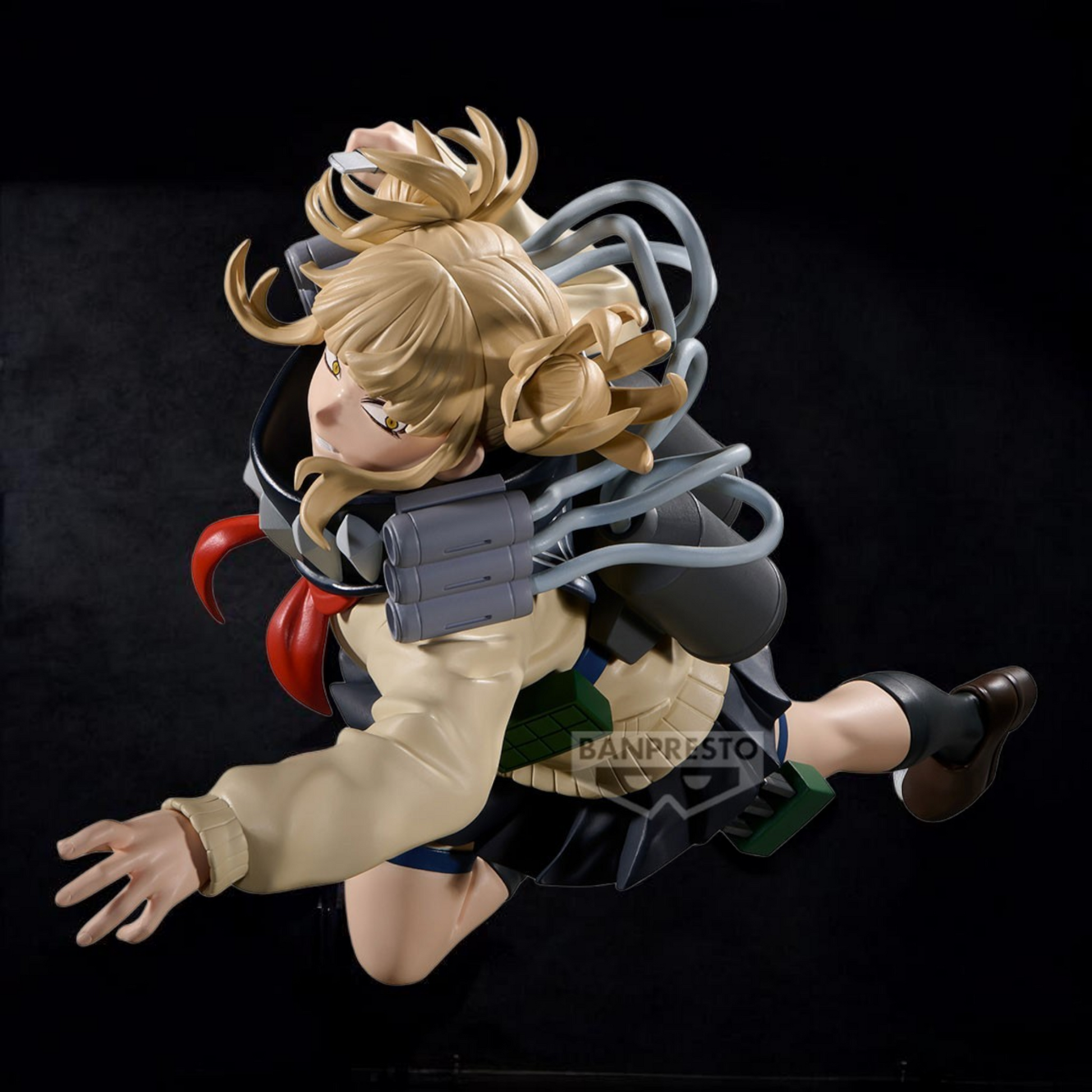 Action figure with blonde hair and a black outfit on a black background