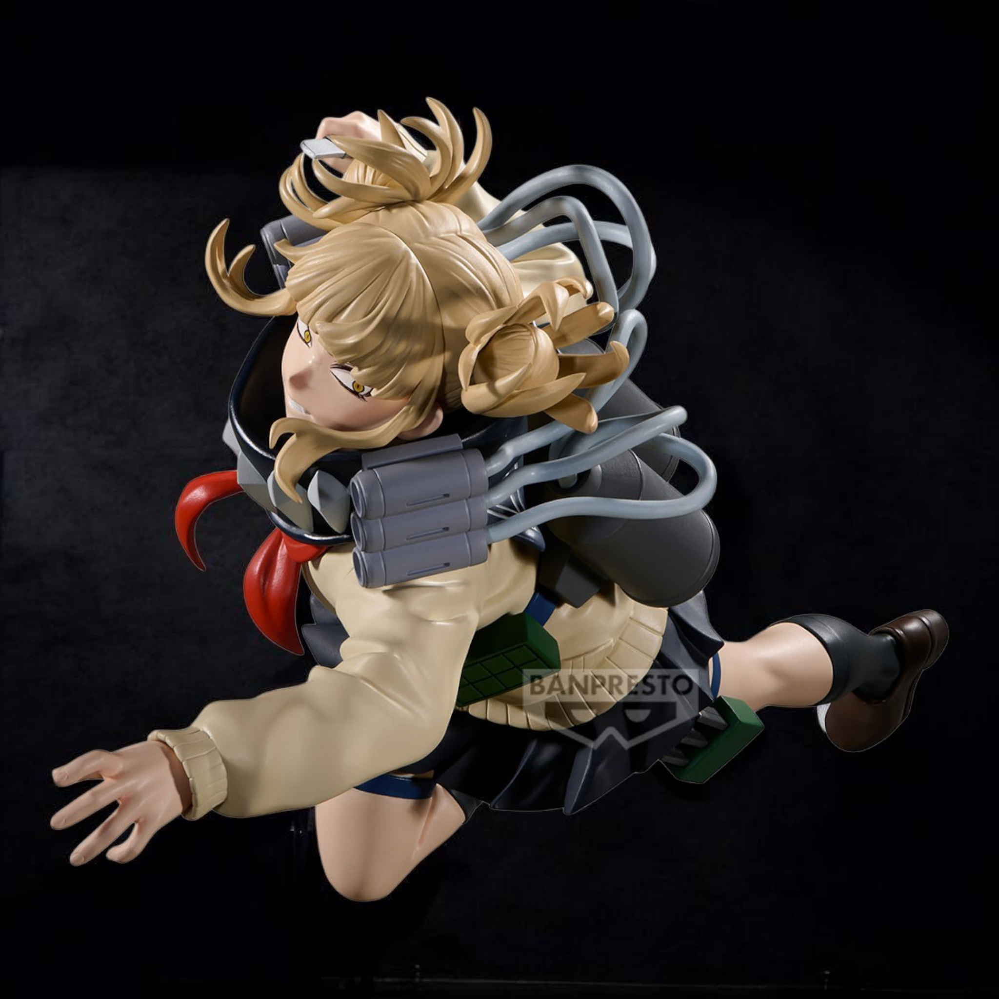 Action figure with blonde hair and a black outfit on a black background