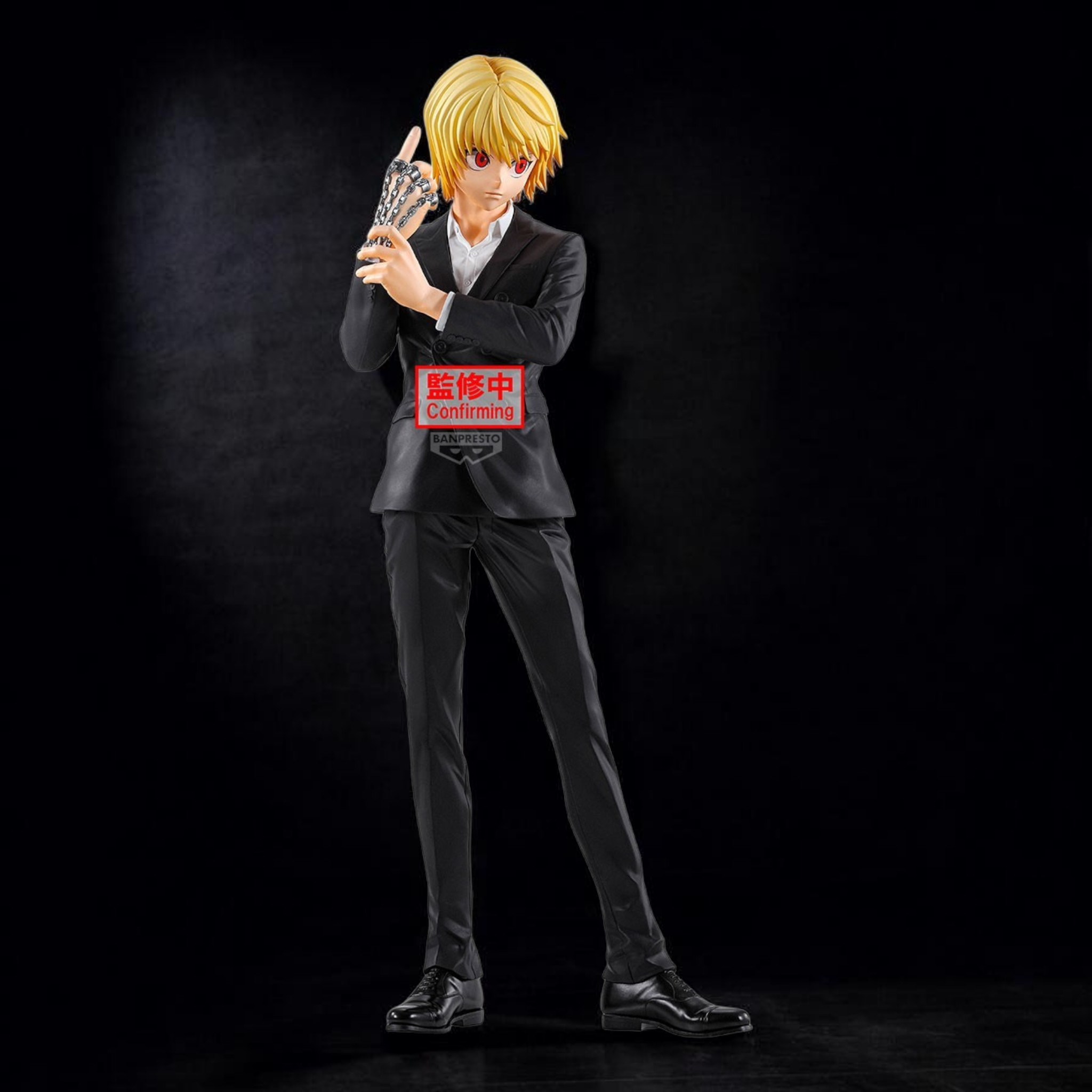 Figure of a character in a suit with a blurred face on a dark background