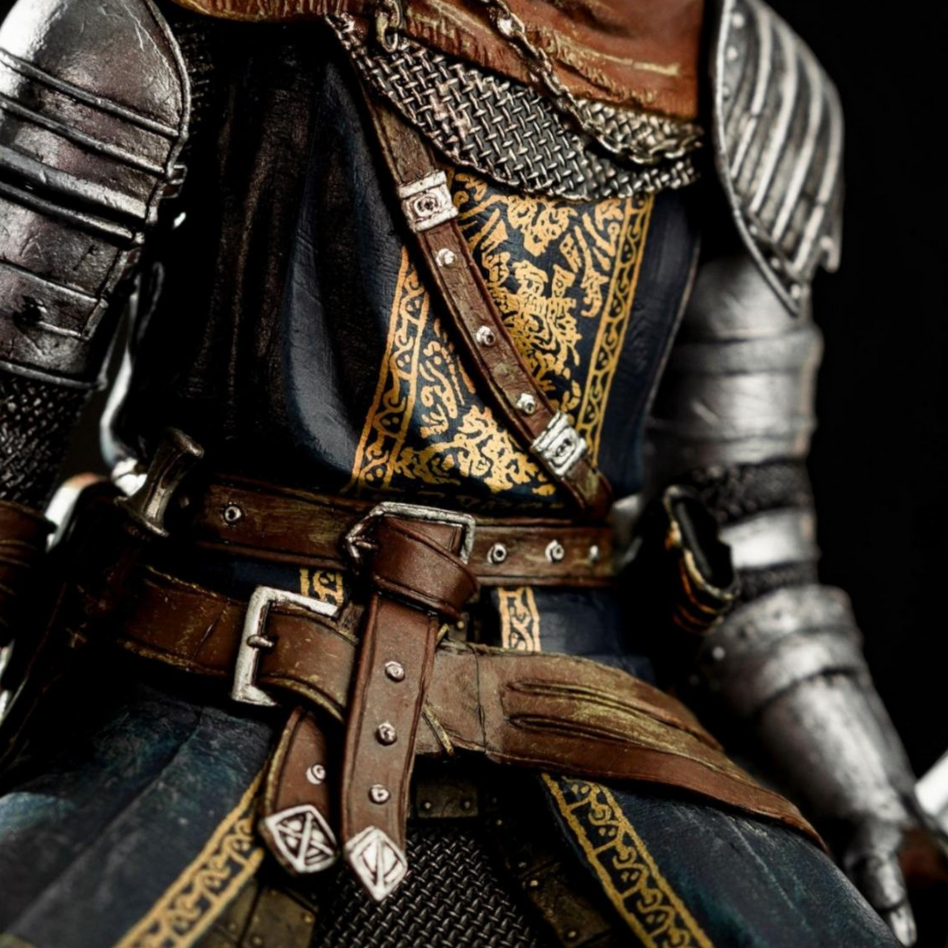 Close-up of a detailed armor with leather straps and metal buckles on a dark background