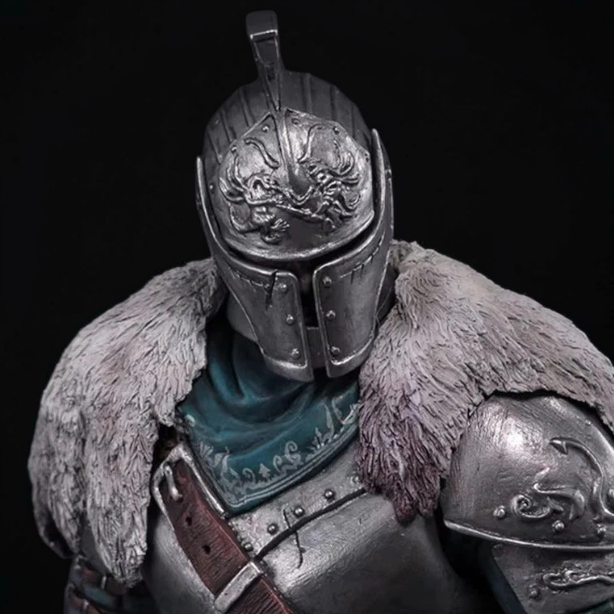 Close-up of a detailed armor with fur and emblem on a black background