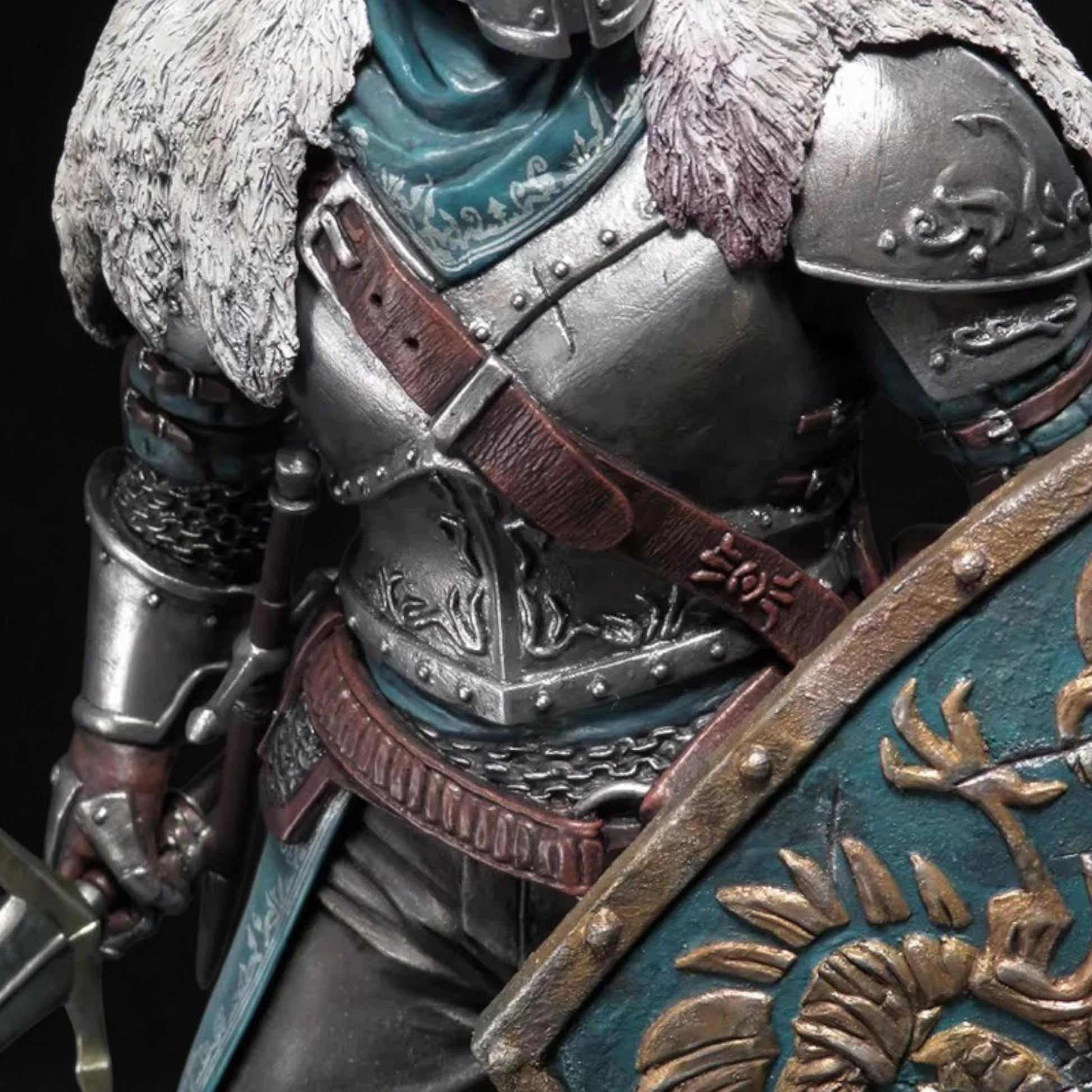 Close-up of a detailed armor with a dragon emblem on a dark background