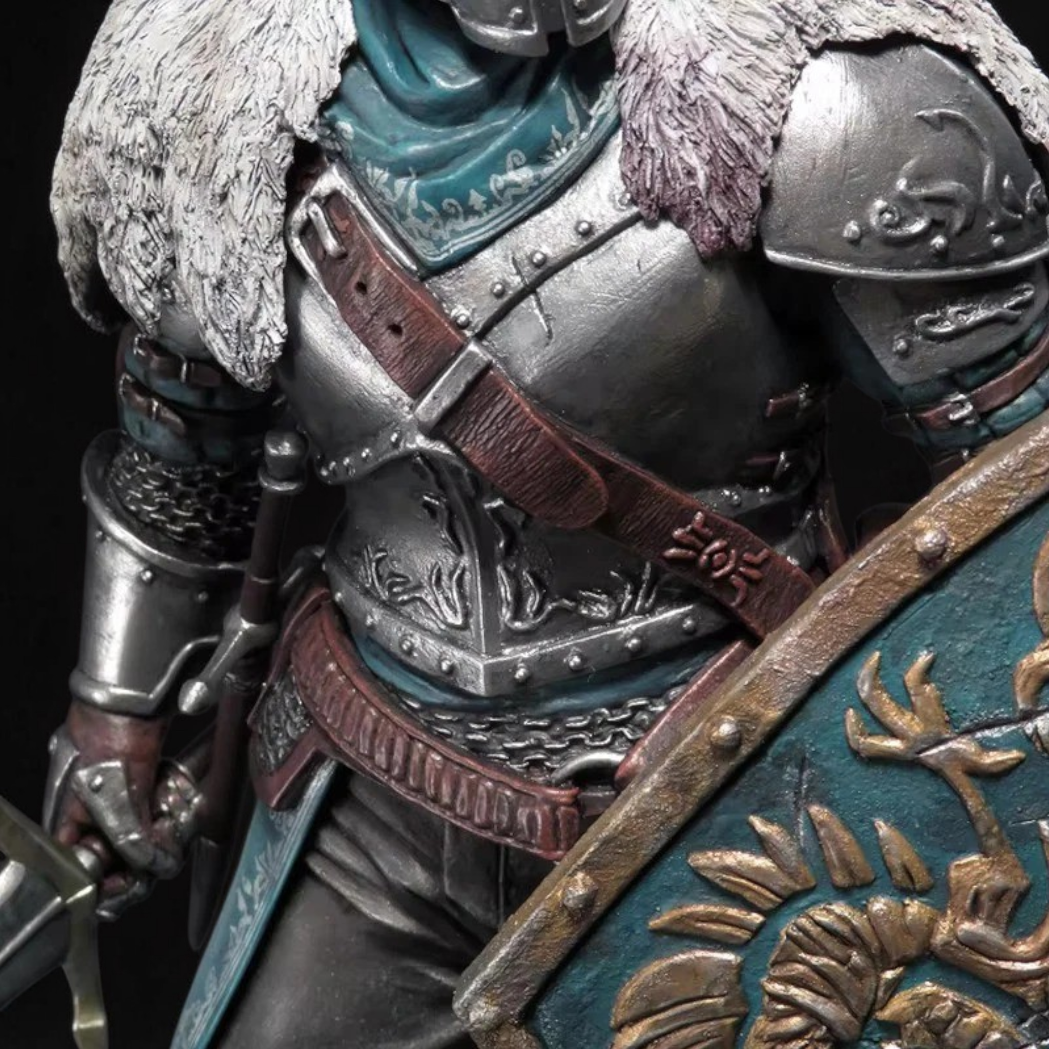 Close-up of a detailed armor with a dragon emblem on a dark background