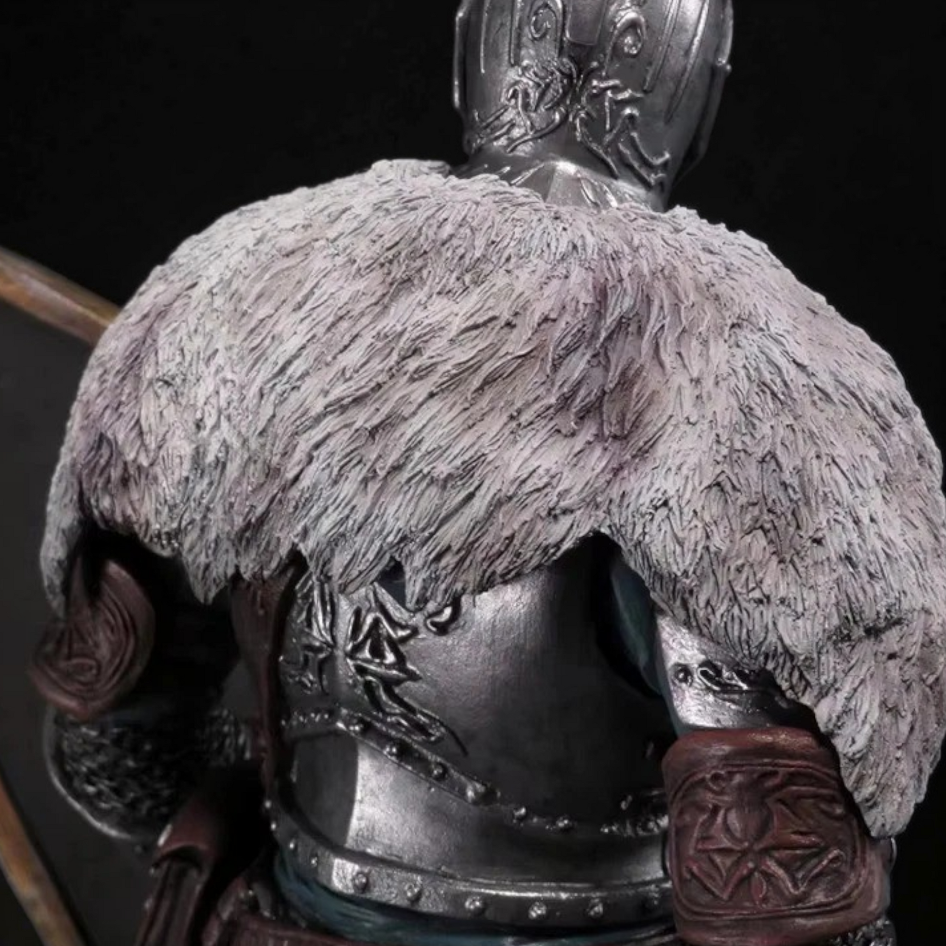 Close-up of a detailed helmet with fur and armor on a dark background