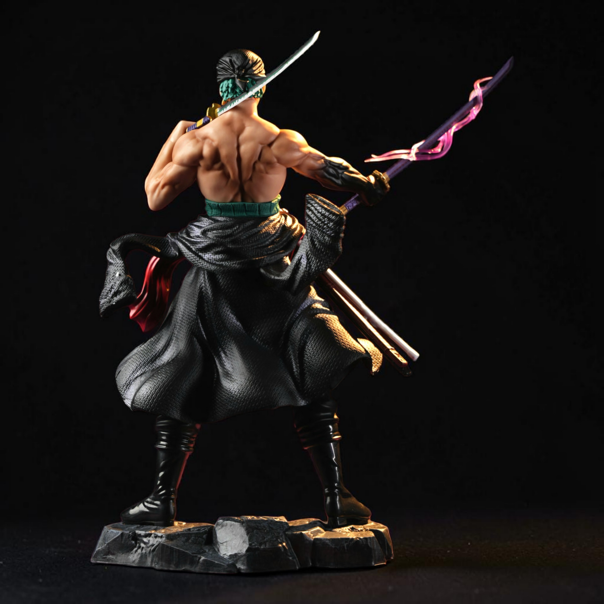 Statue of a warrior with a sword on a black background