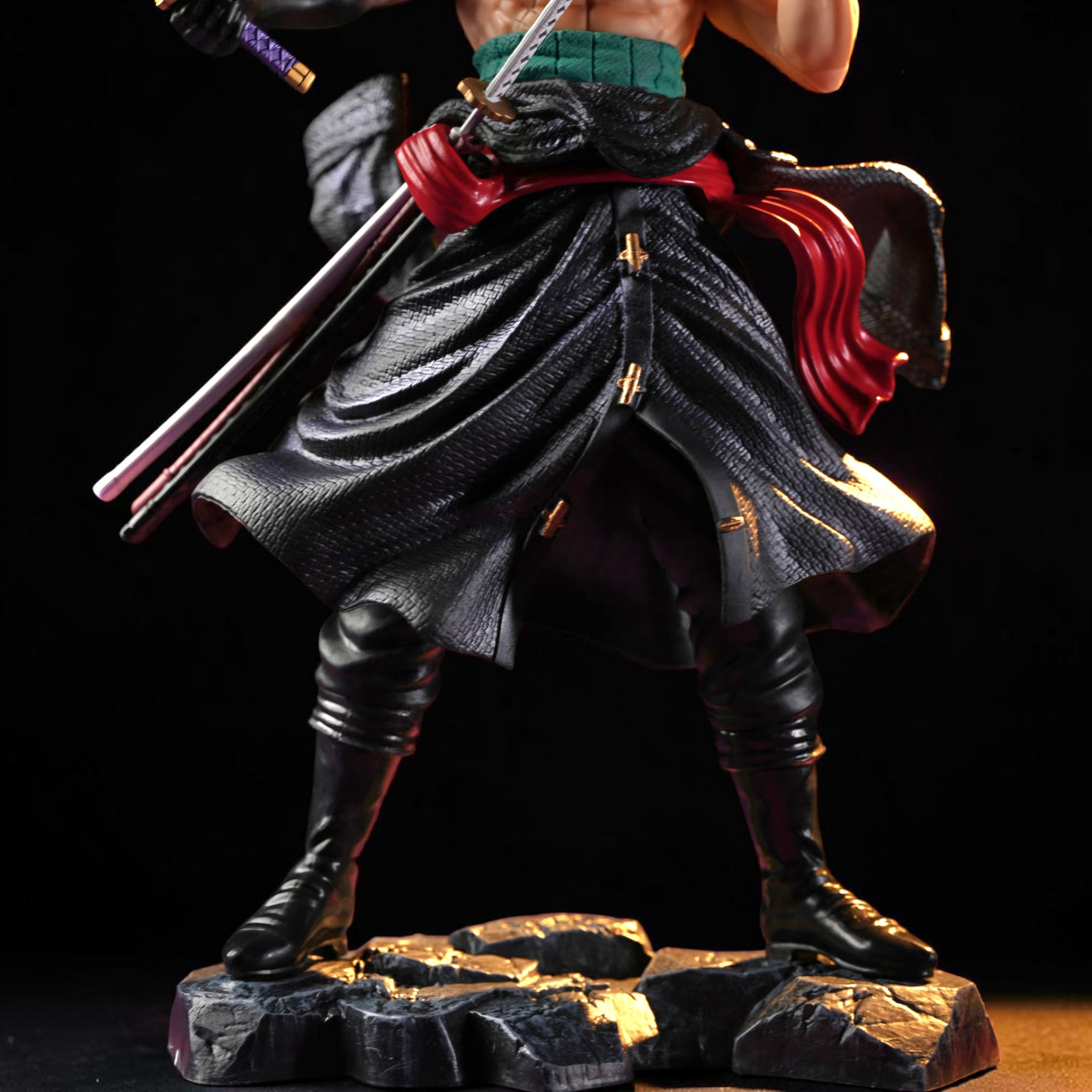 Figurine of a warrior in traditional attire with a sword on a dark background