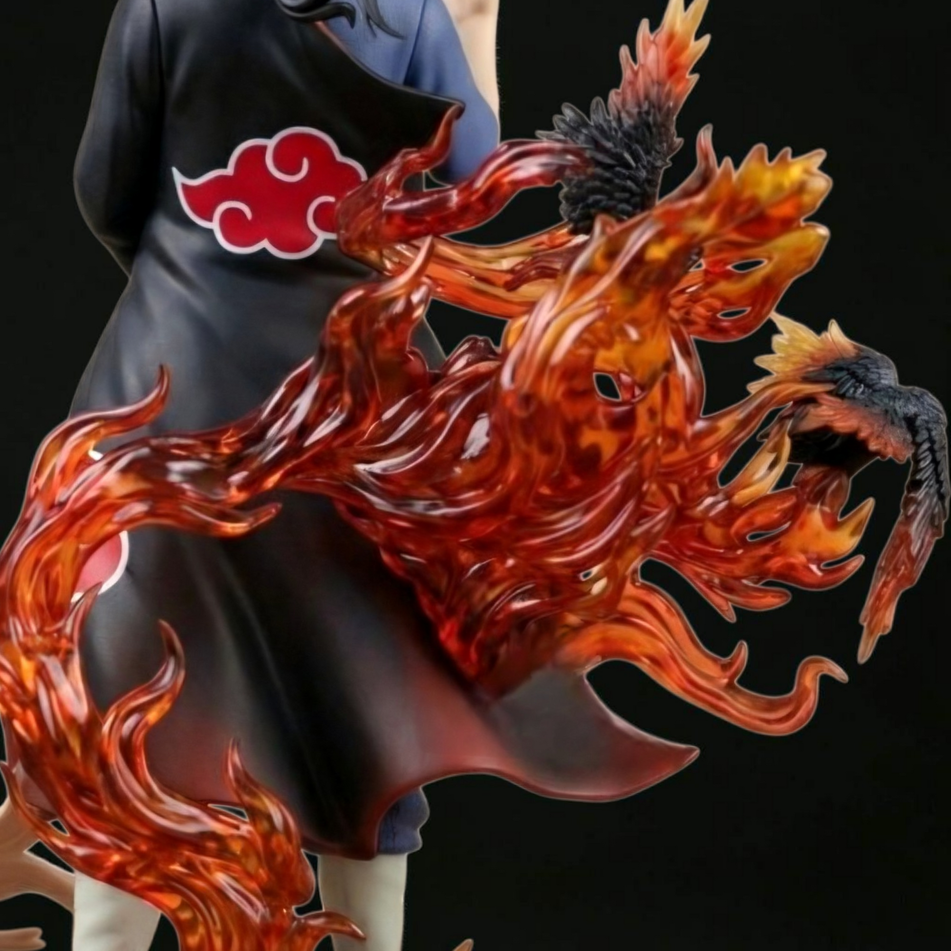 Statue of a character with a fiery design on a black background