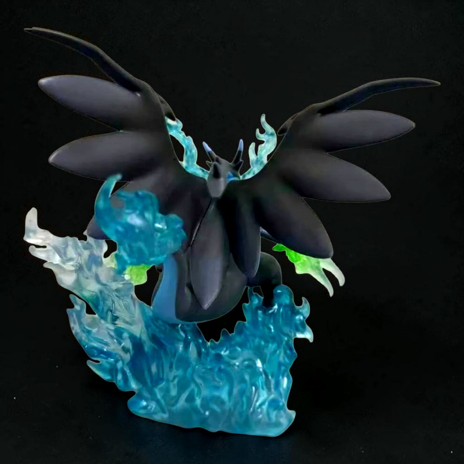 Glowing dark blue and black dragon-like creature on a black background