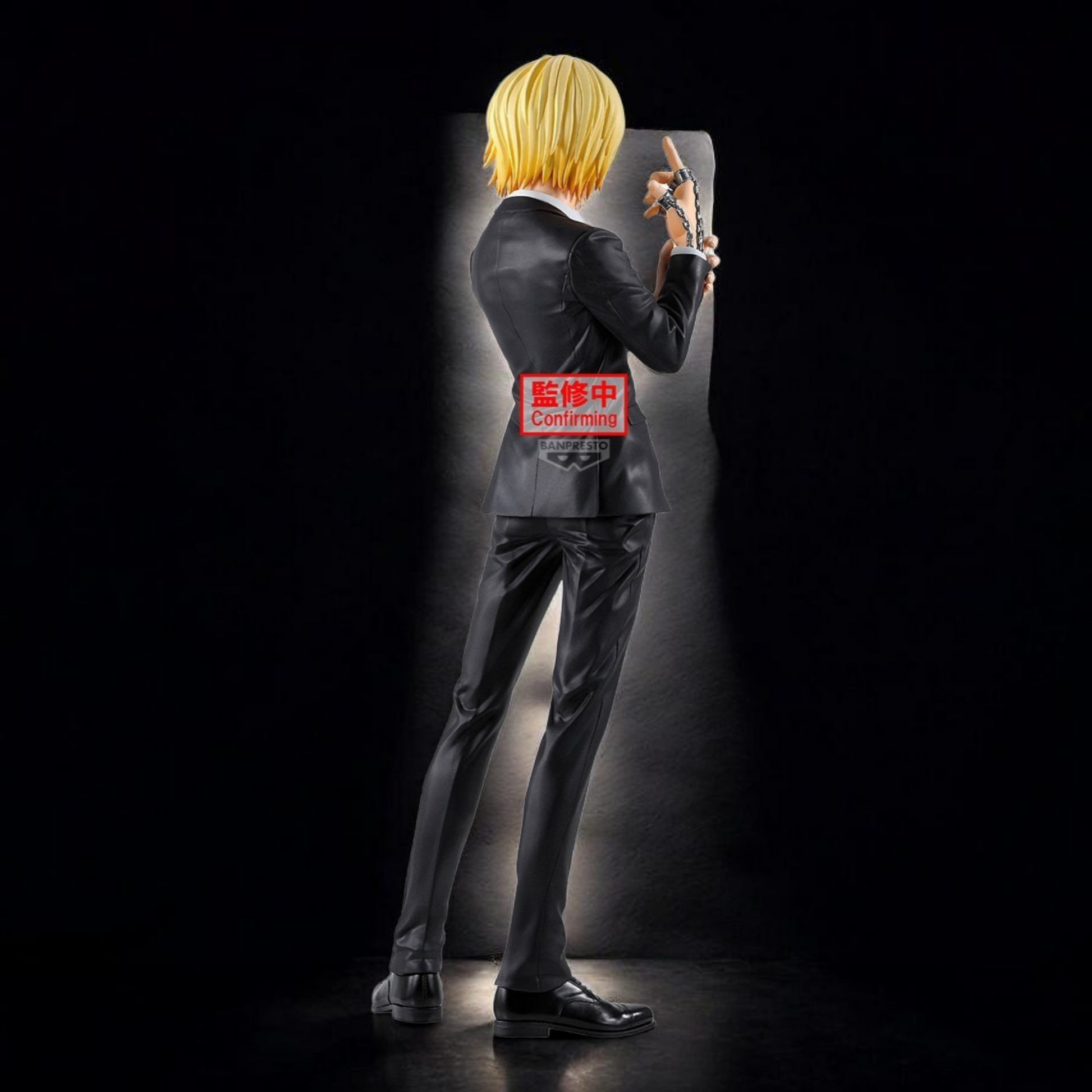 Mannequin wearing a suit with a visible brand logo against a dark background