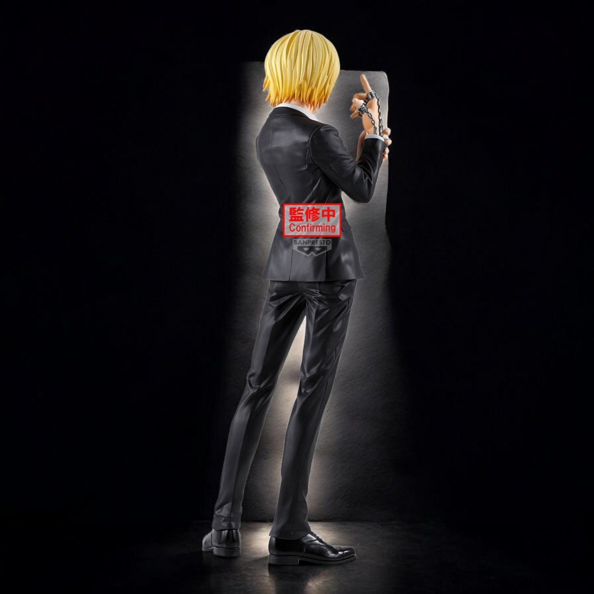 Mannequin wearing a suit with a visible brand logo against a dark background