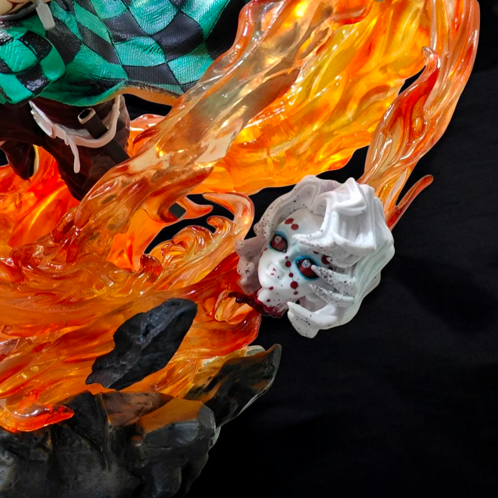 Close-up of a dragon-like creature with fiery effects and a small white creature on a black background