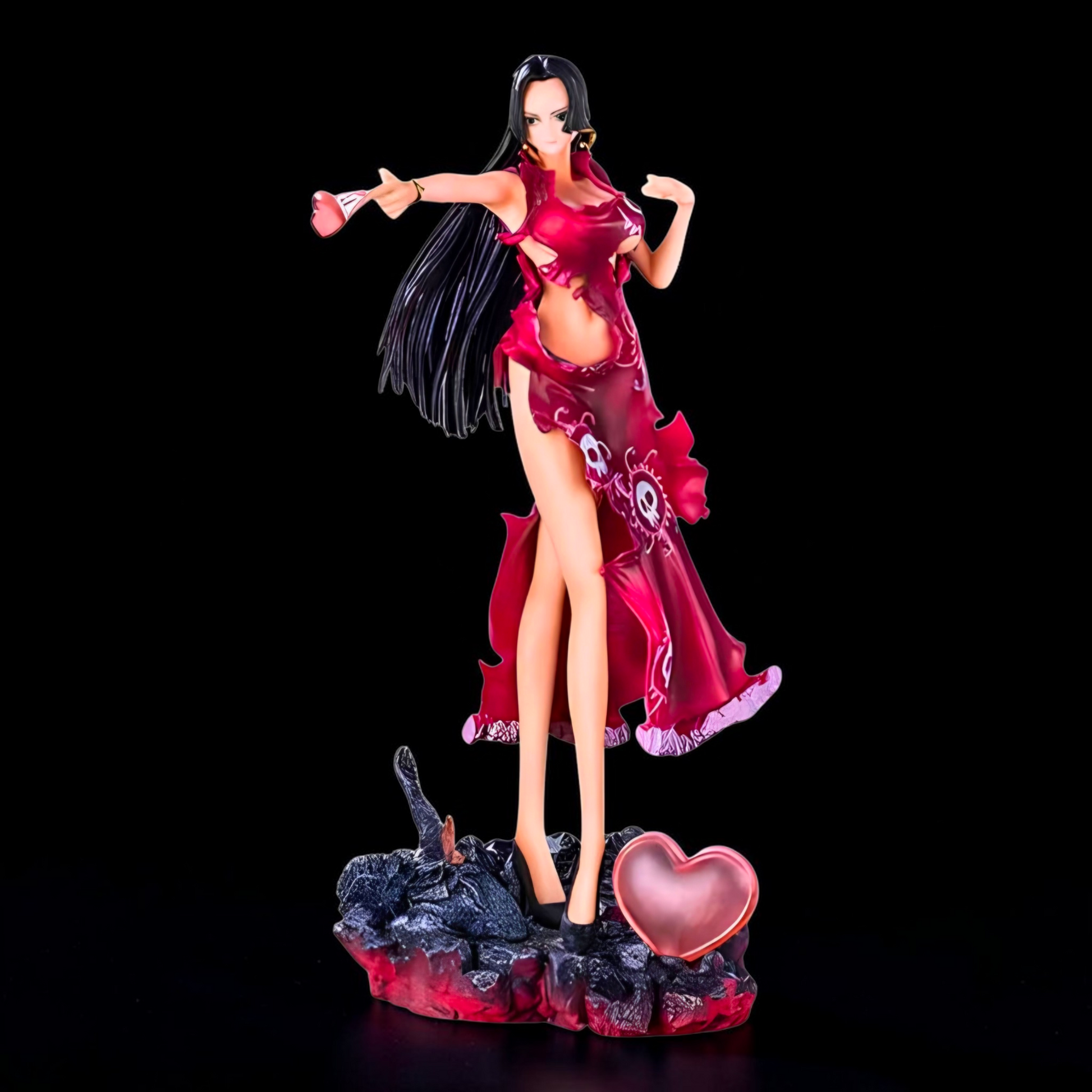Figurine of a character in a red outfit with a heart-shaped object on a black background