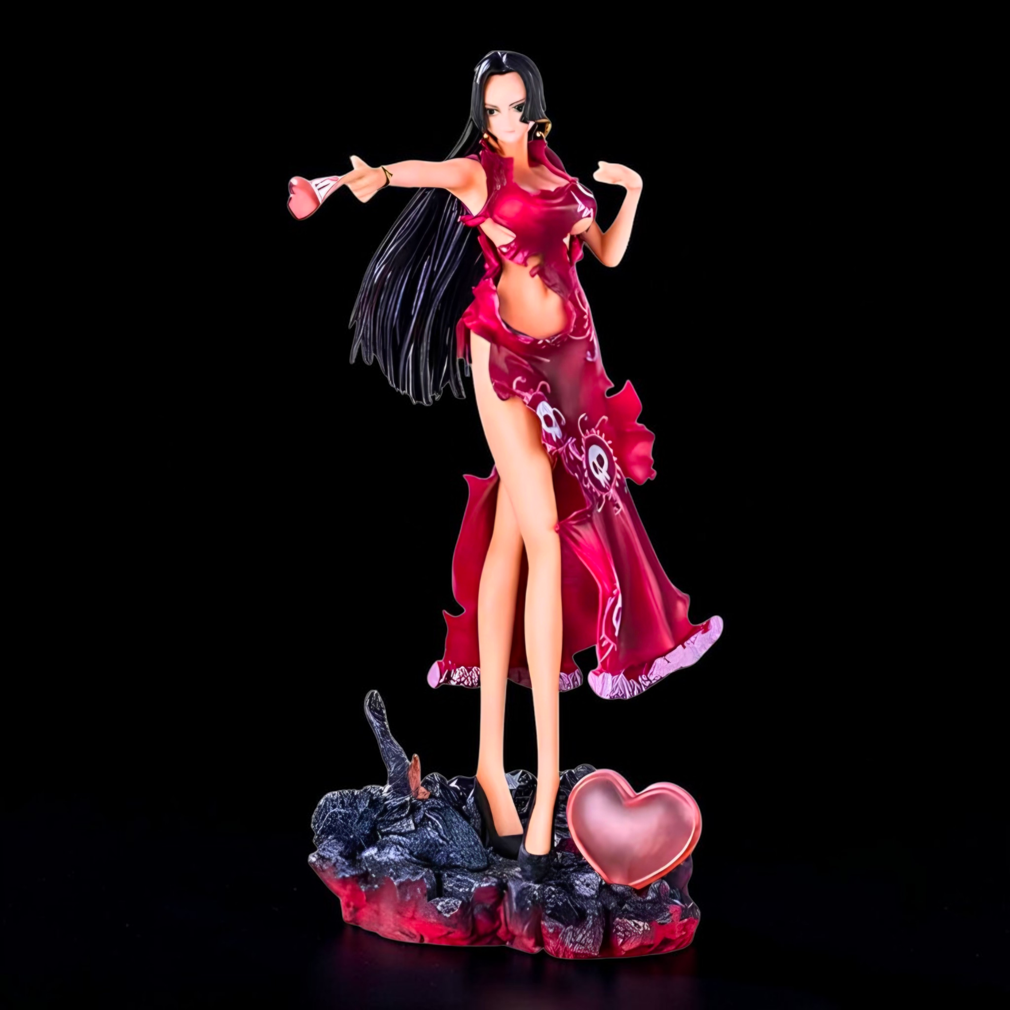 Figurine of a character in a red outfit with a heart-shaped object on a black background