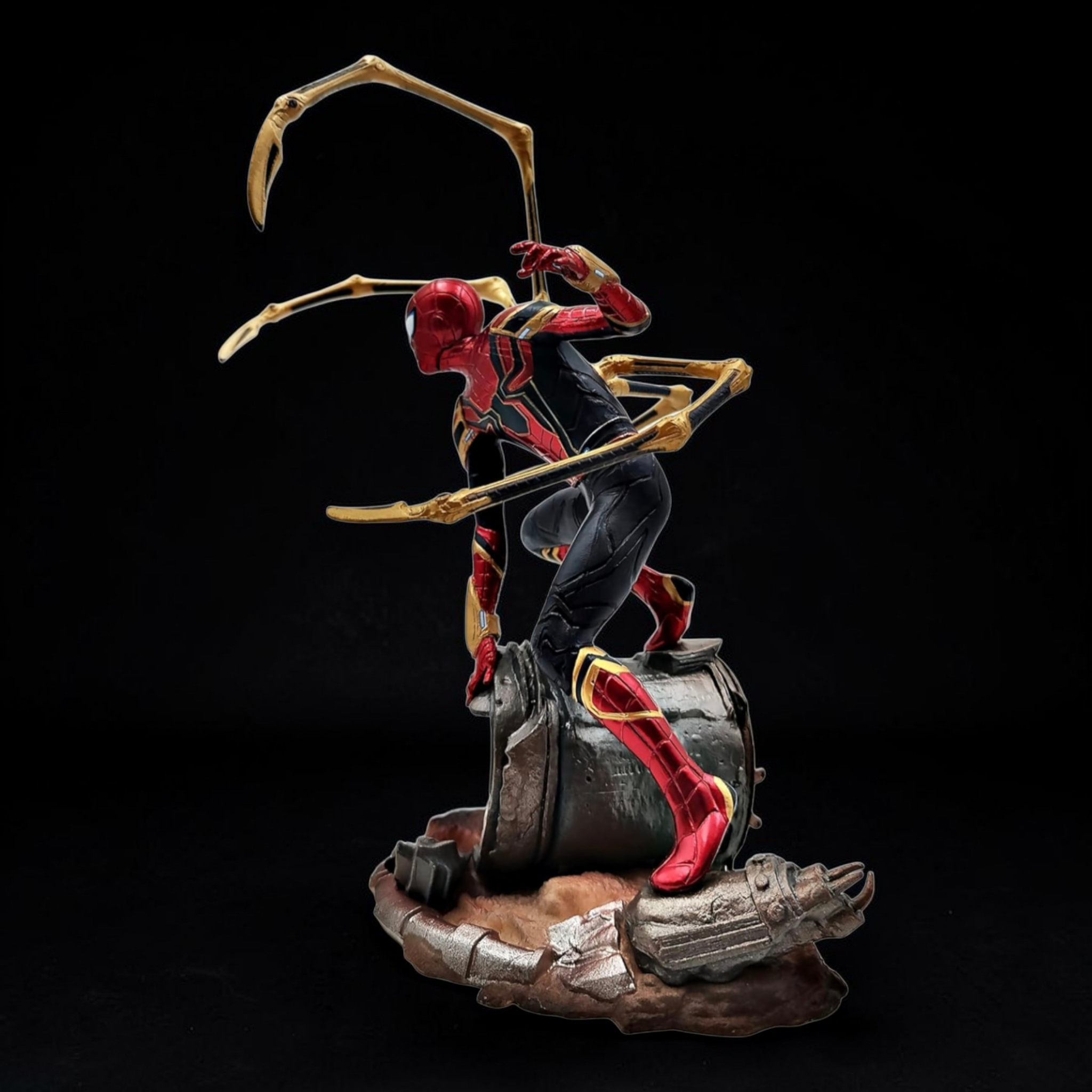 Statue of a superhero character with a scythe on a dark background