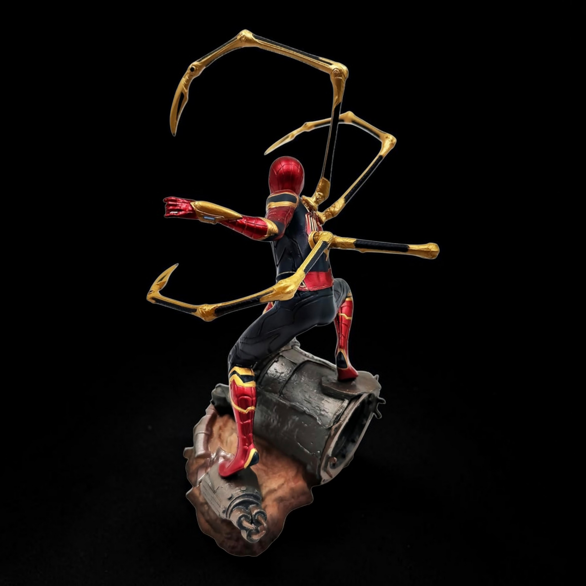 Statue of a superhero with spider-like legs on a dark background
