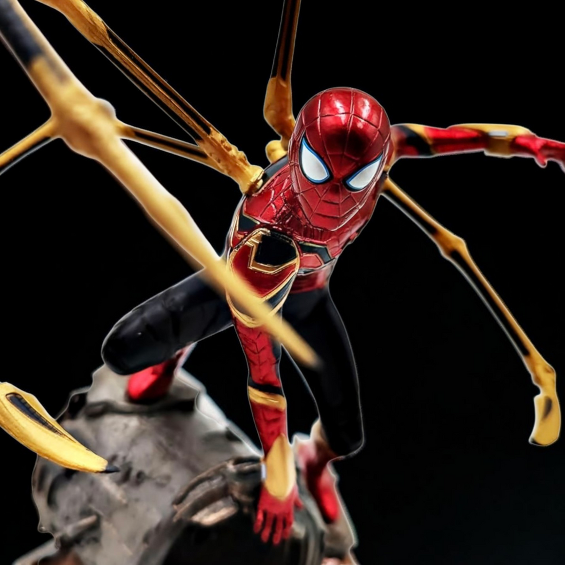 Spider-Man figure with web-shooters in an urban explosion scene
