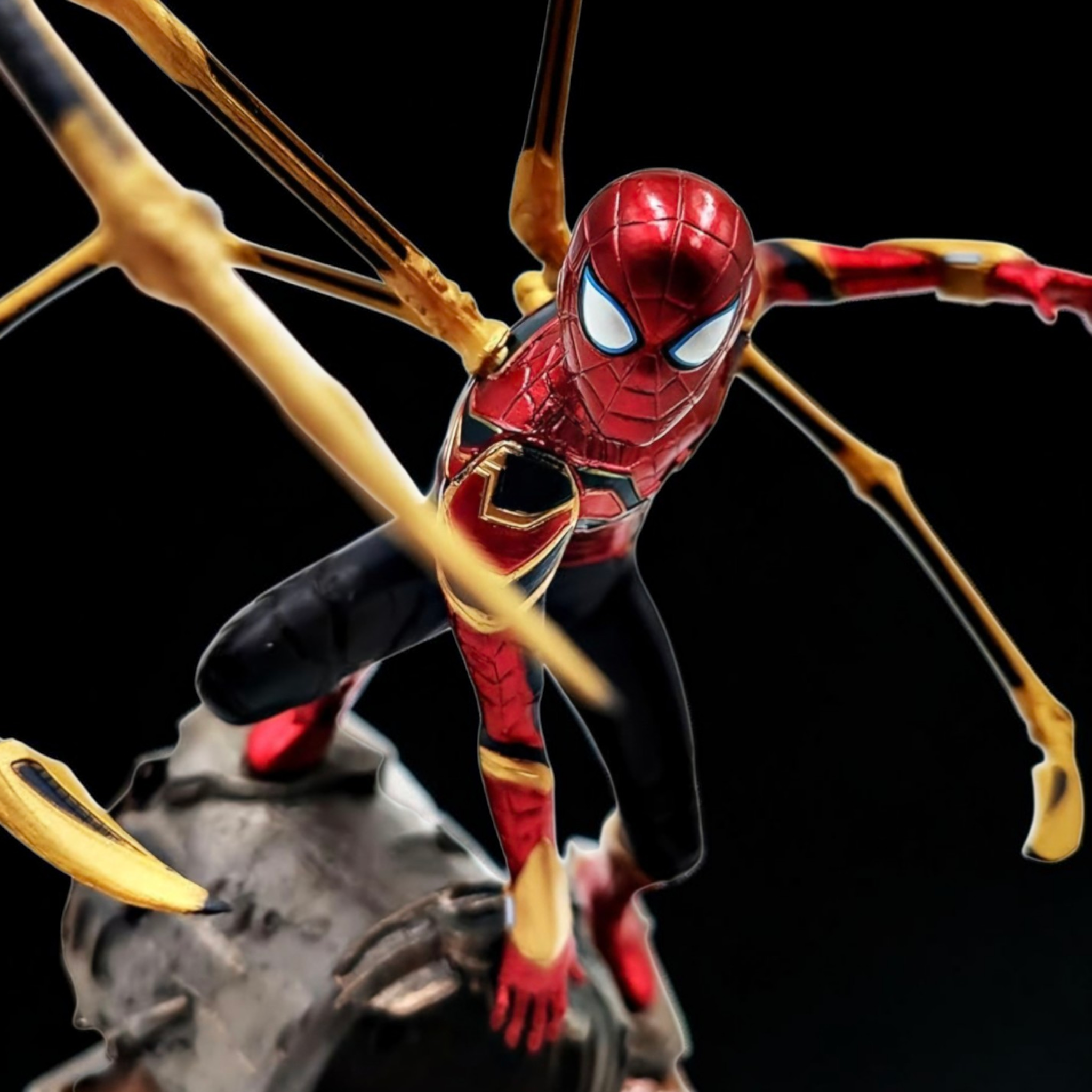 Spider-Man figure in a dynamic pose with a dark background