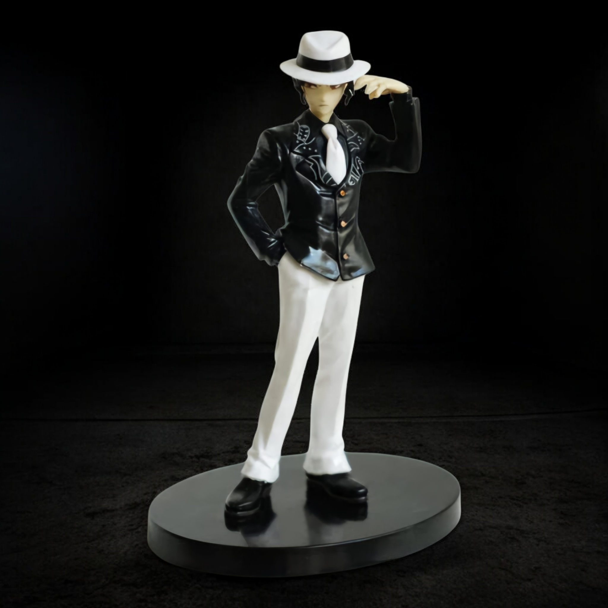 Figurine of a character in a stylish outfit with a hat on a black background