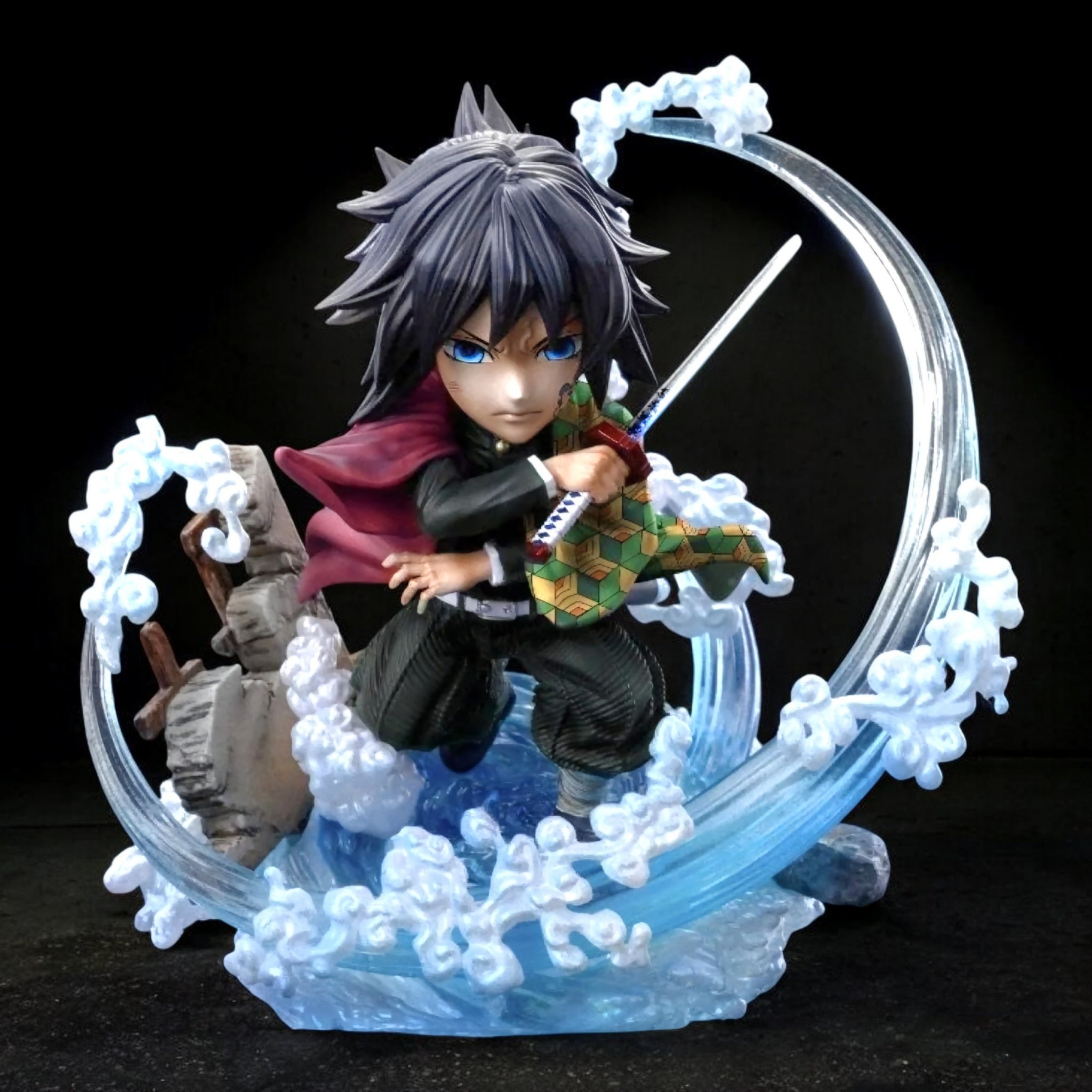 Figurine of a character with a sword in a decorative circular frame on a black background