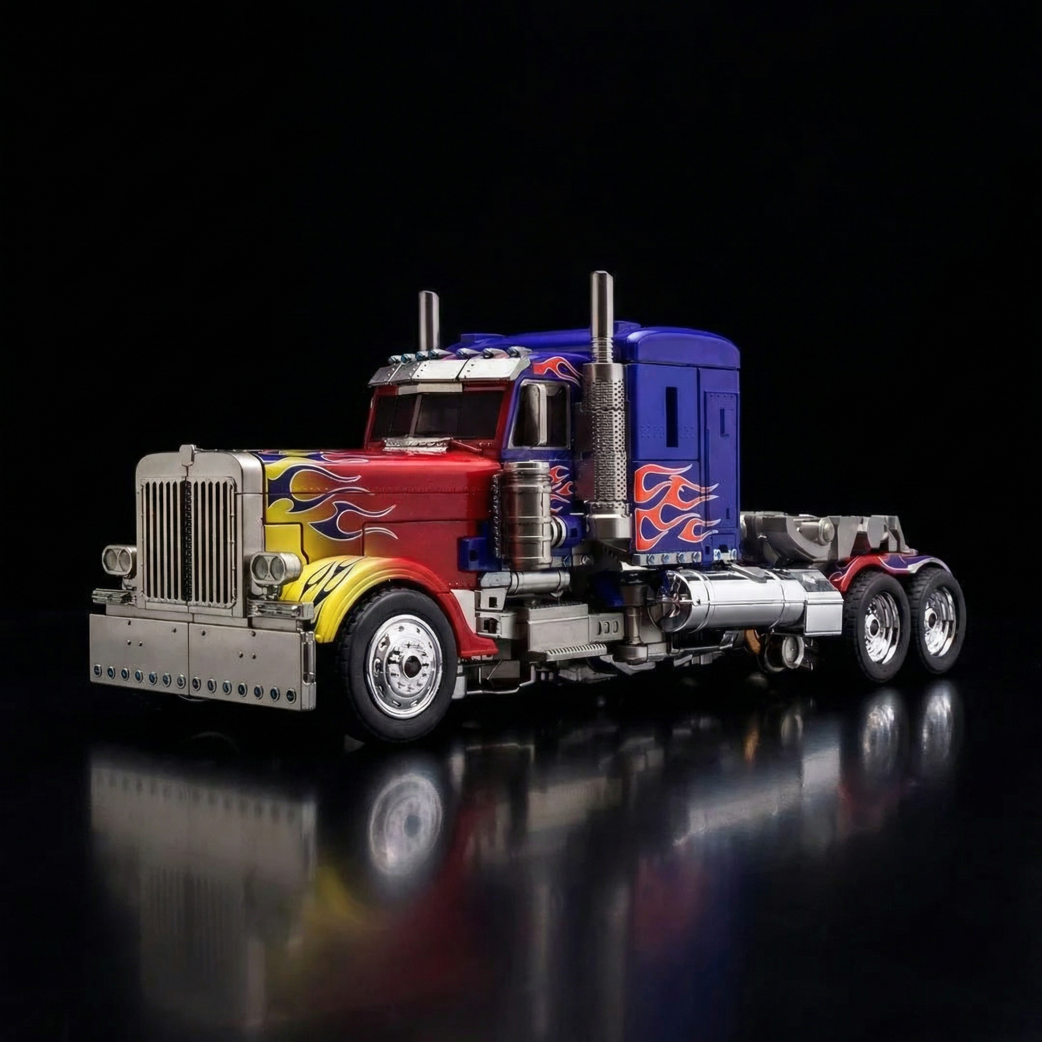 Model of a truck with colorful design on a black background
