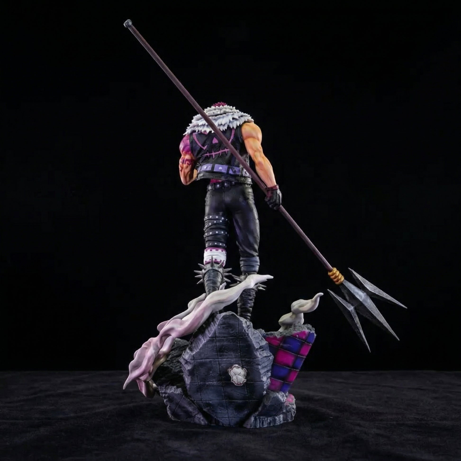 Action figure with a large weapon on a dark background