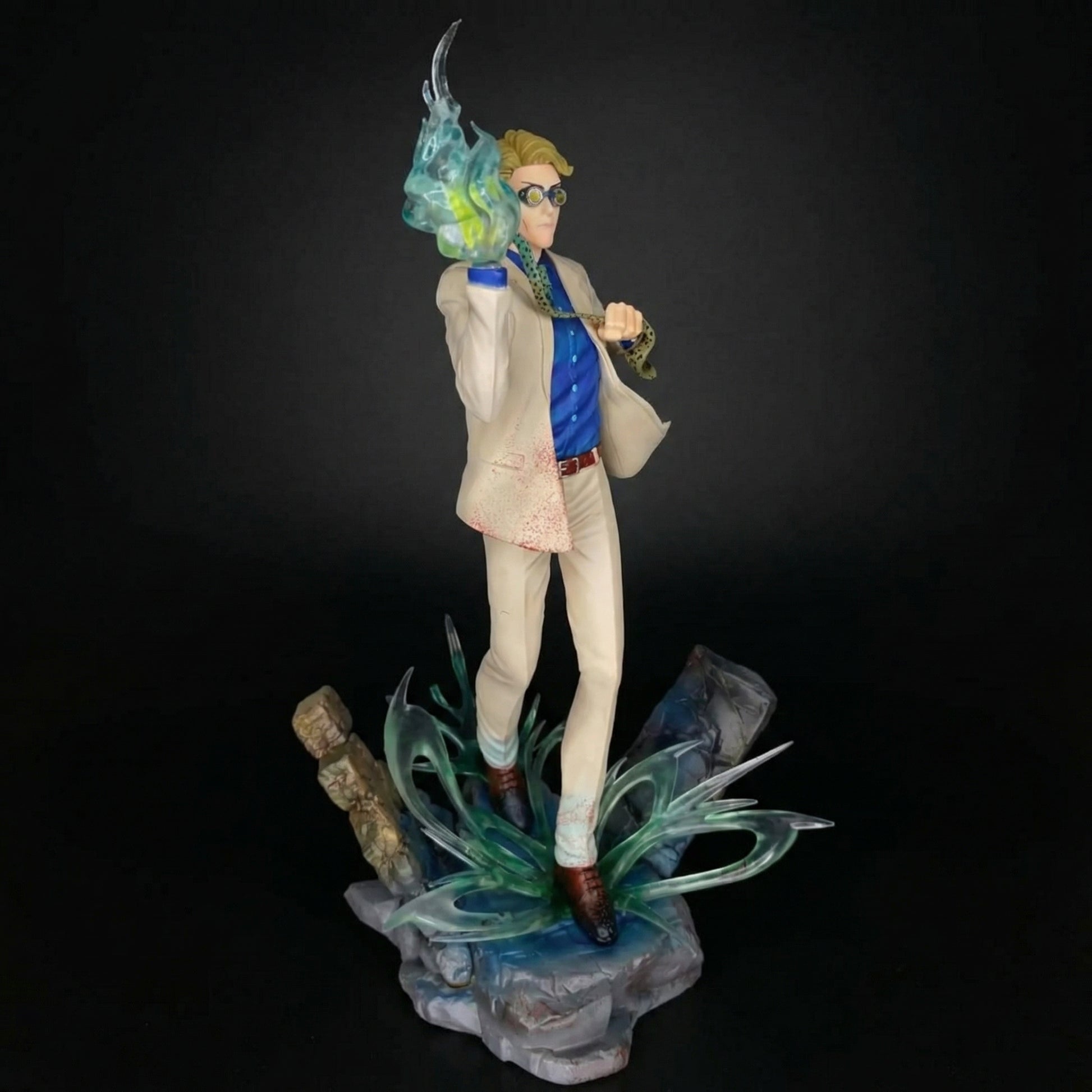 Figurine of a character with a futuristic outfit and helmet on a dark background