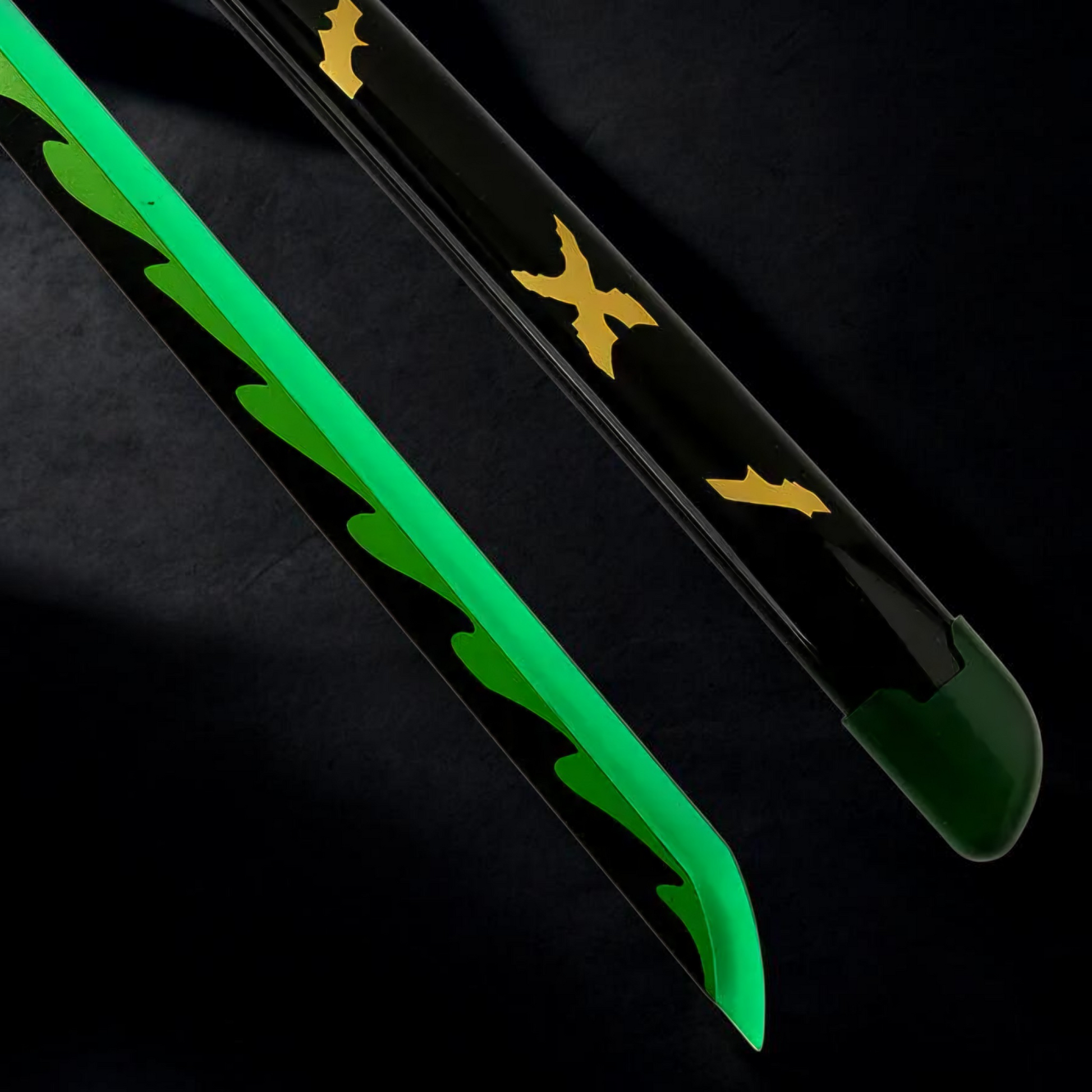 Green and black ski with gold logo on a black background