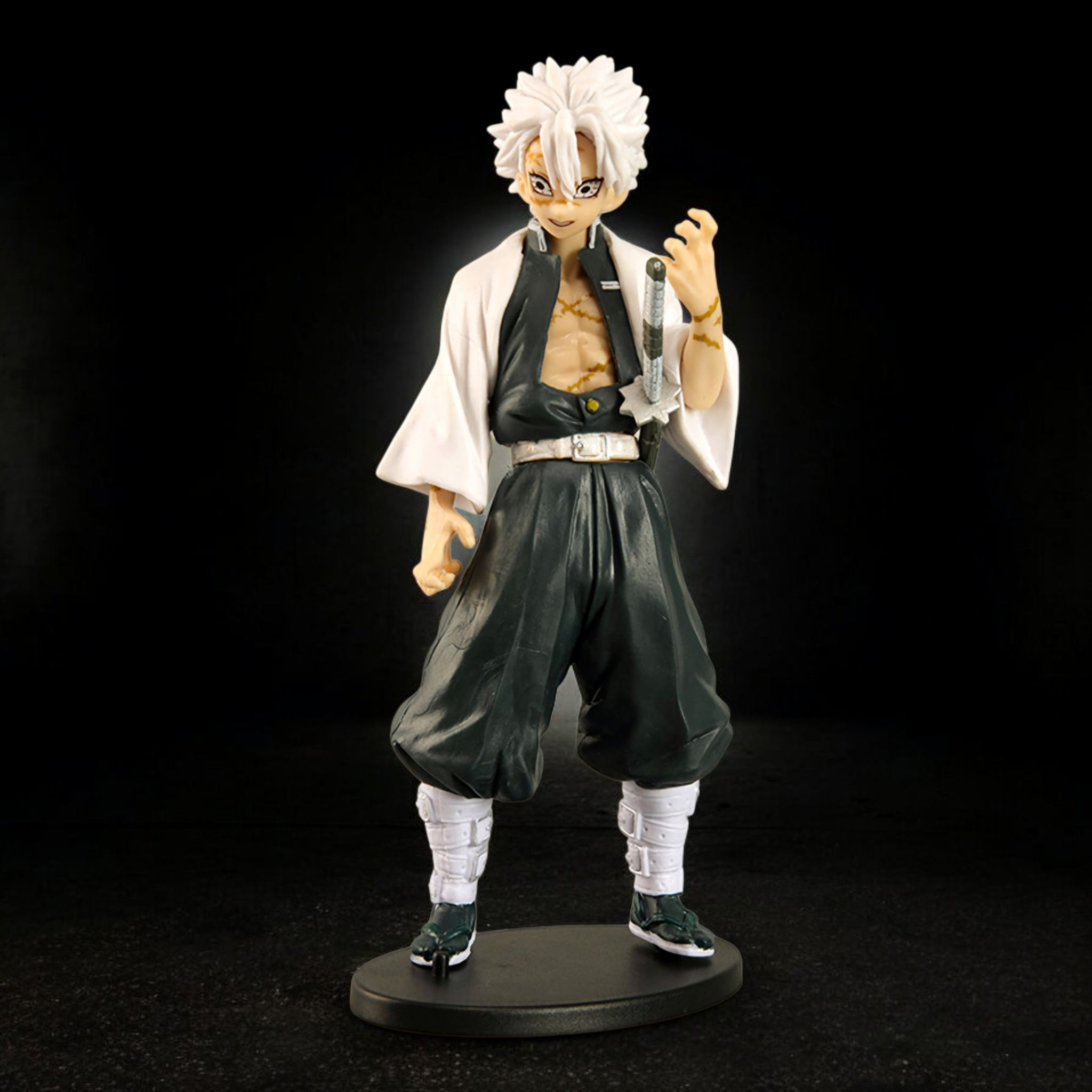 Action figure of a character with white hair and traditional outfit on a black background