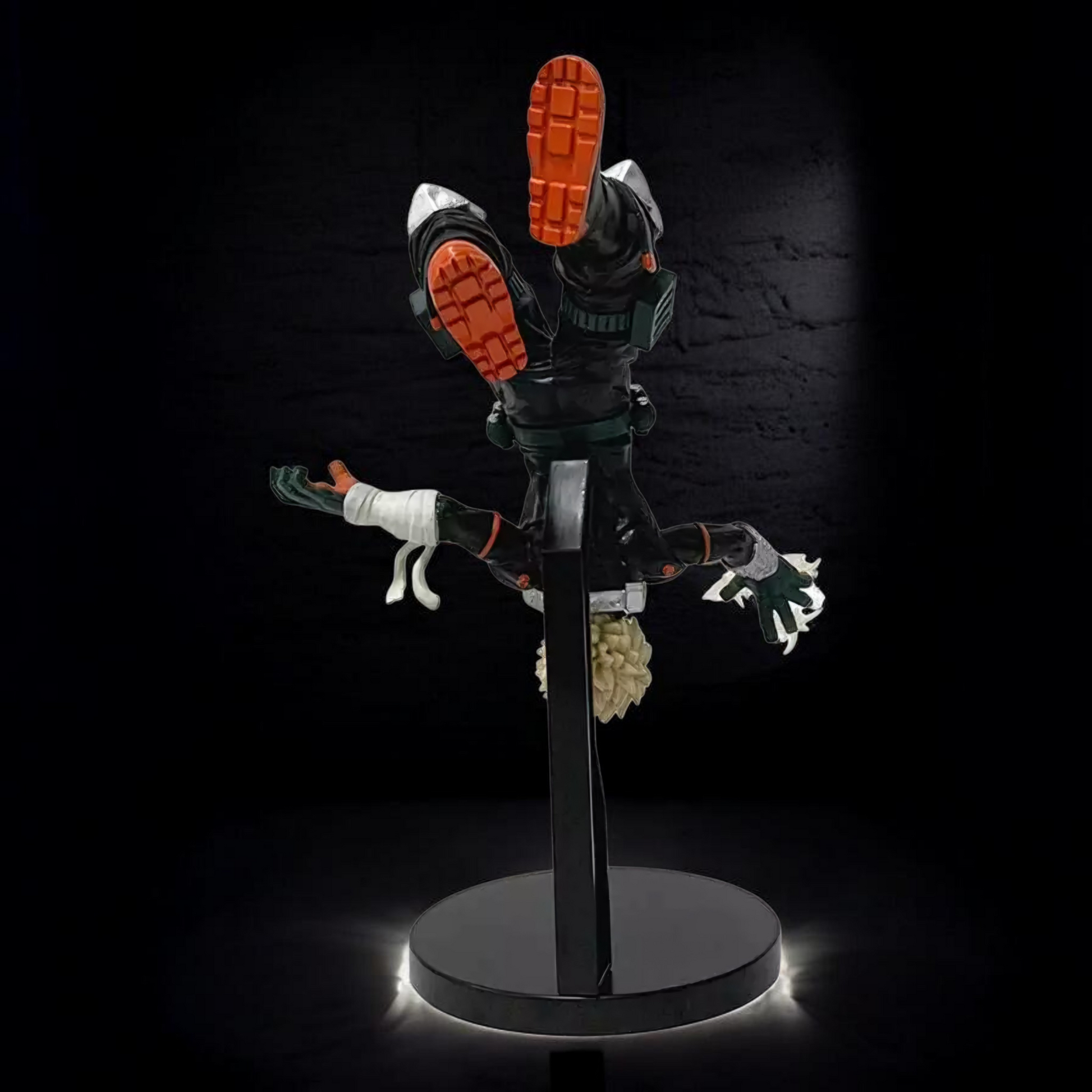 Toy figure on a stand with a dark background