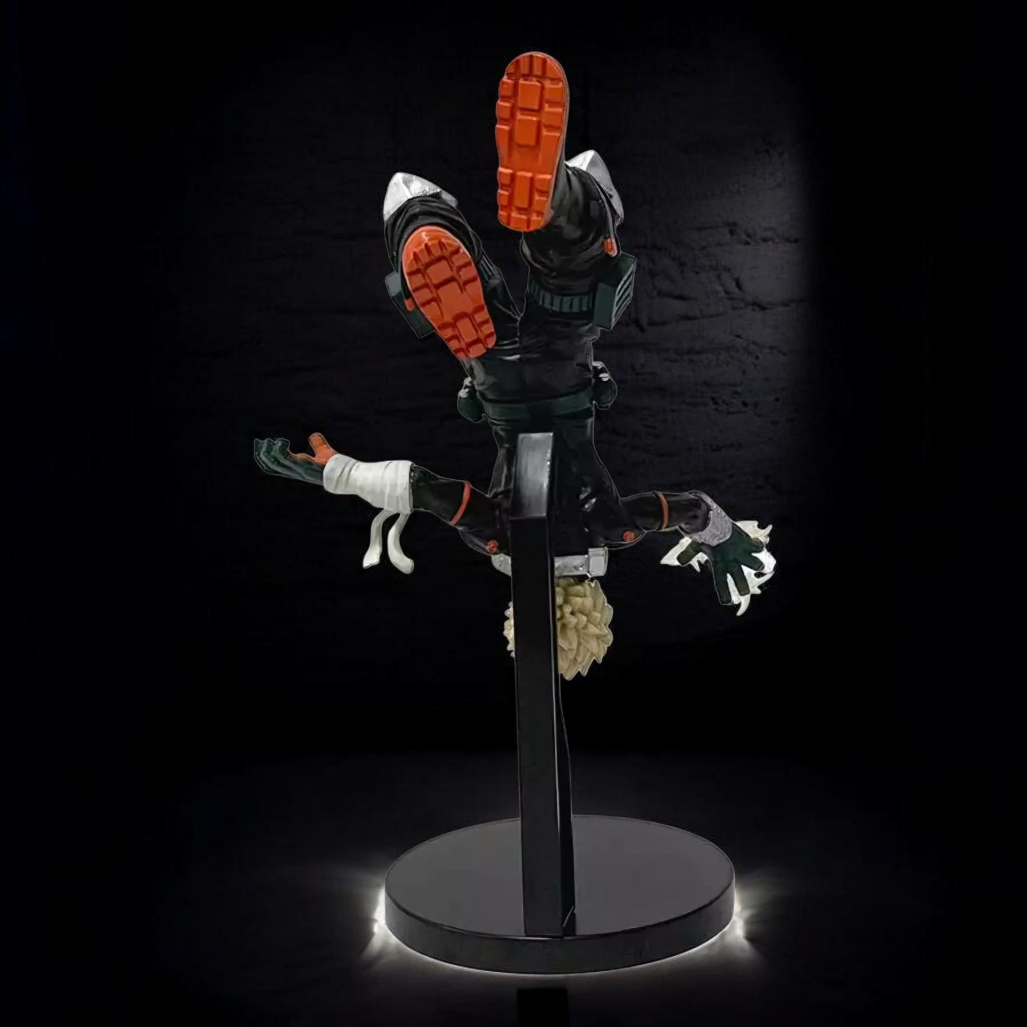 Toy figure on a stand with a dark background