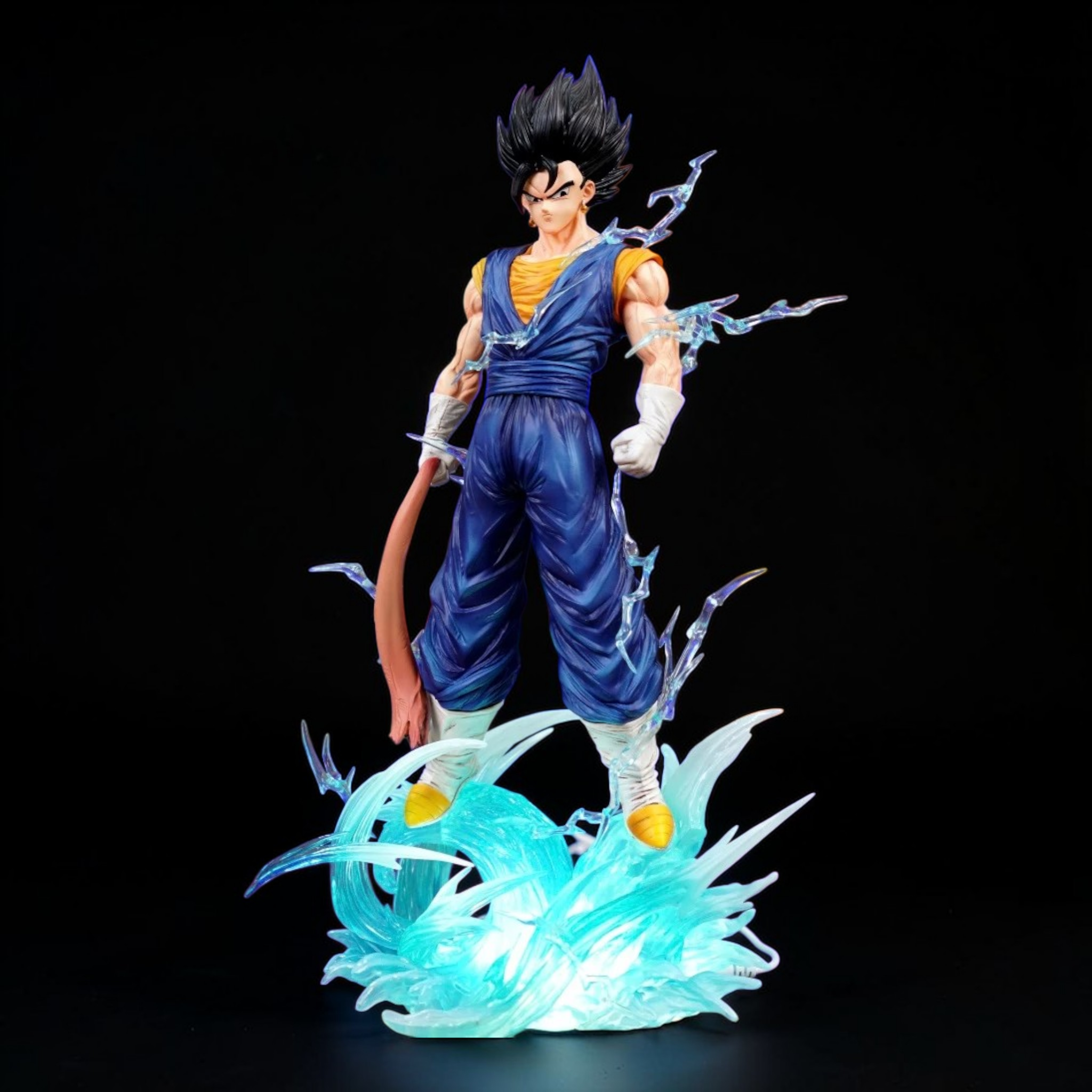 Action figure with blue outfit and energy effects on a black background