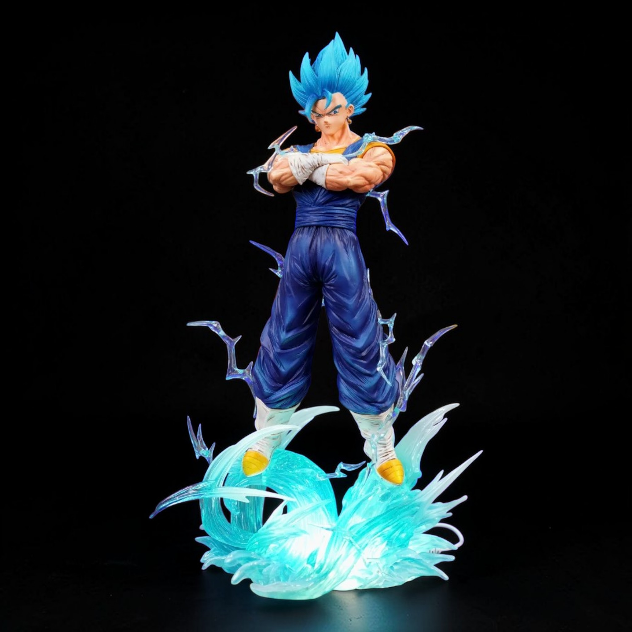 Super Saiyan Blue Goku figure with energy effects on a black background